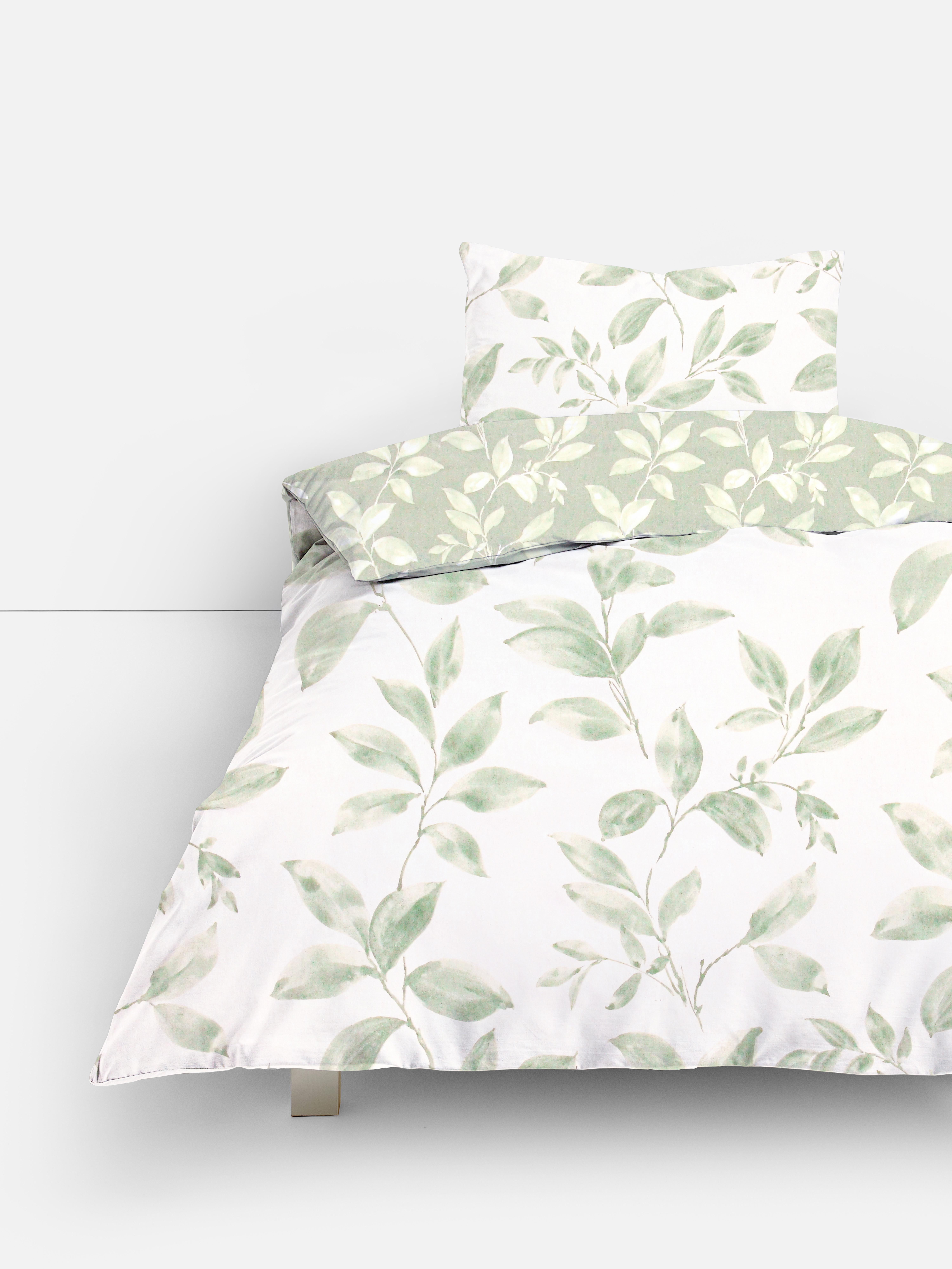 Set de husă de pilotă reversibilă cu motiv de frunze. O husă de pilotă florală cu design reversibil.