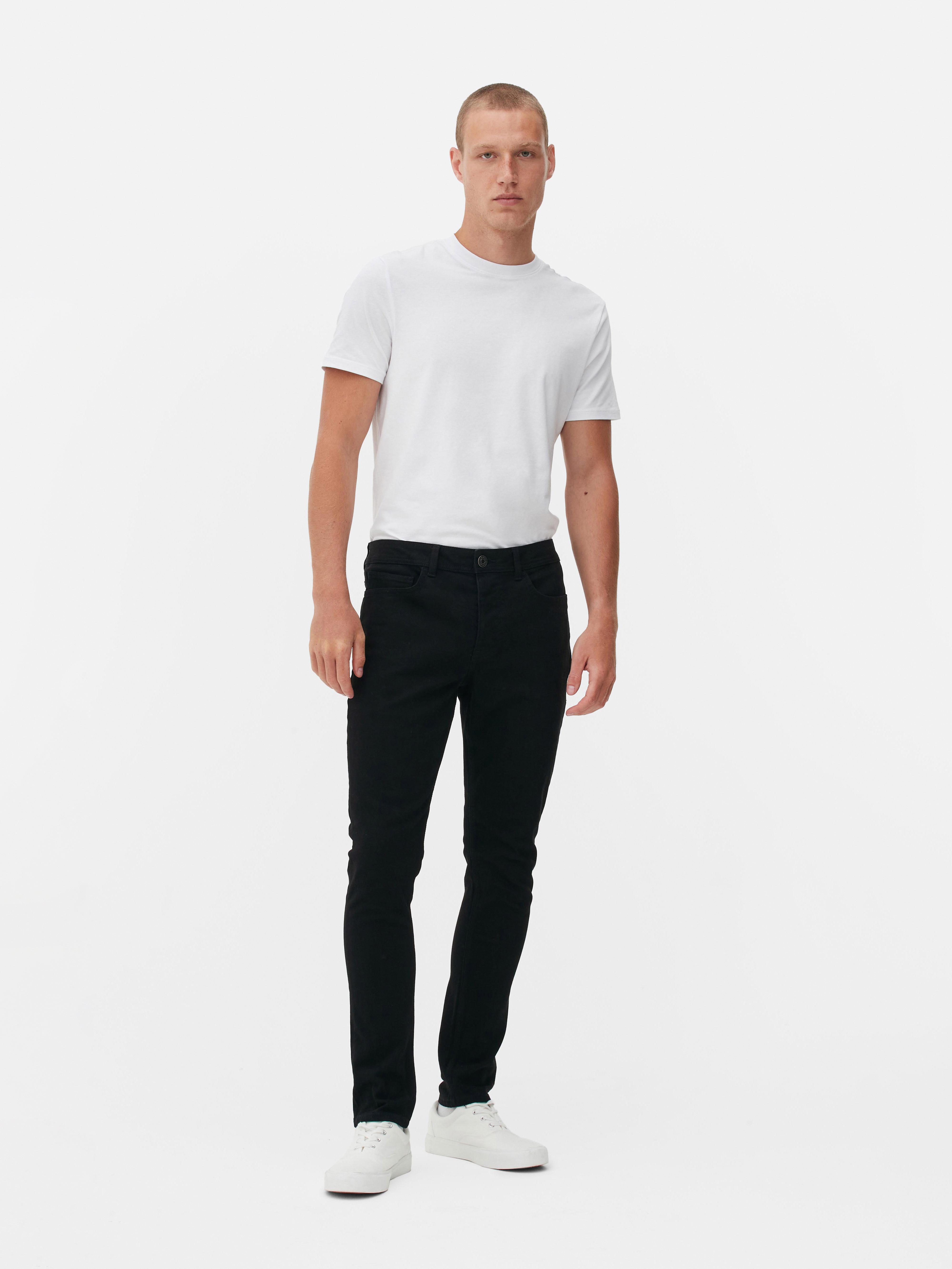 Pantaloni skinny din bumbac twill. Acești pantaloni skinny din bumbac twill prezintă elemente clasice, precum cinci buzunare și găici pentru curea.
