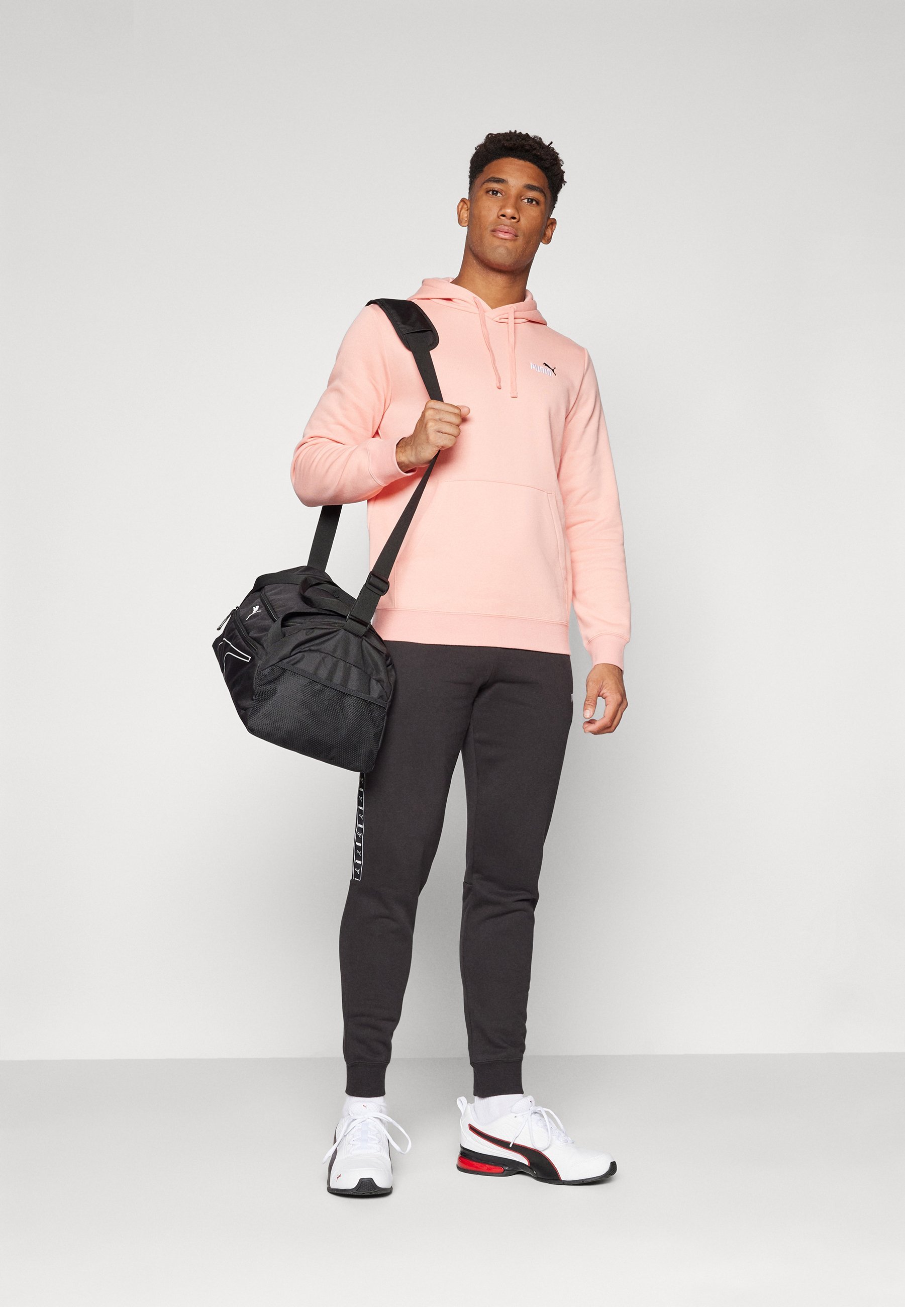Puma TAPE SWEATPANTS - Spodnji del trenirke - črn