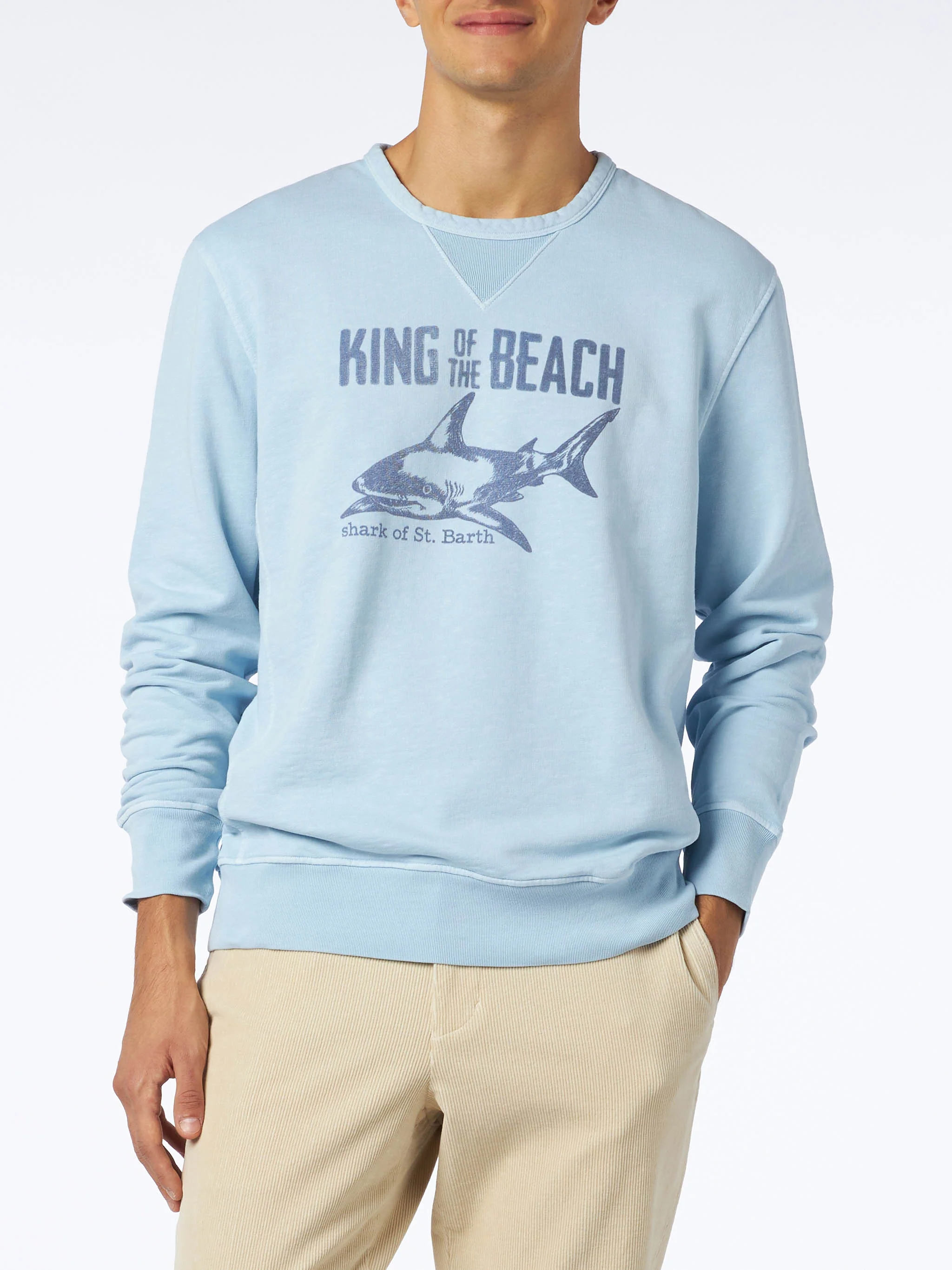 Blauwe sweater Koning van het strand