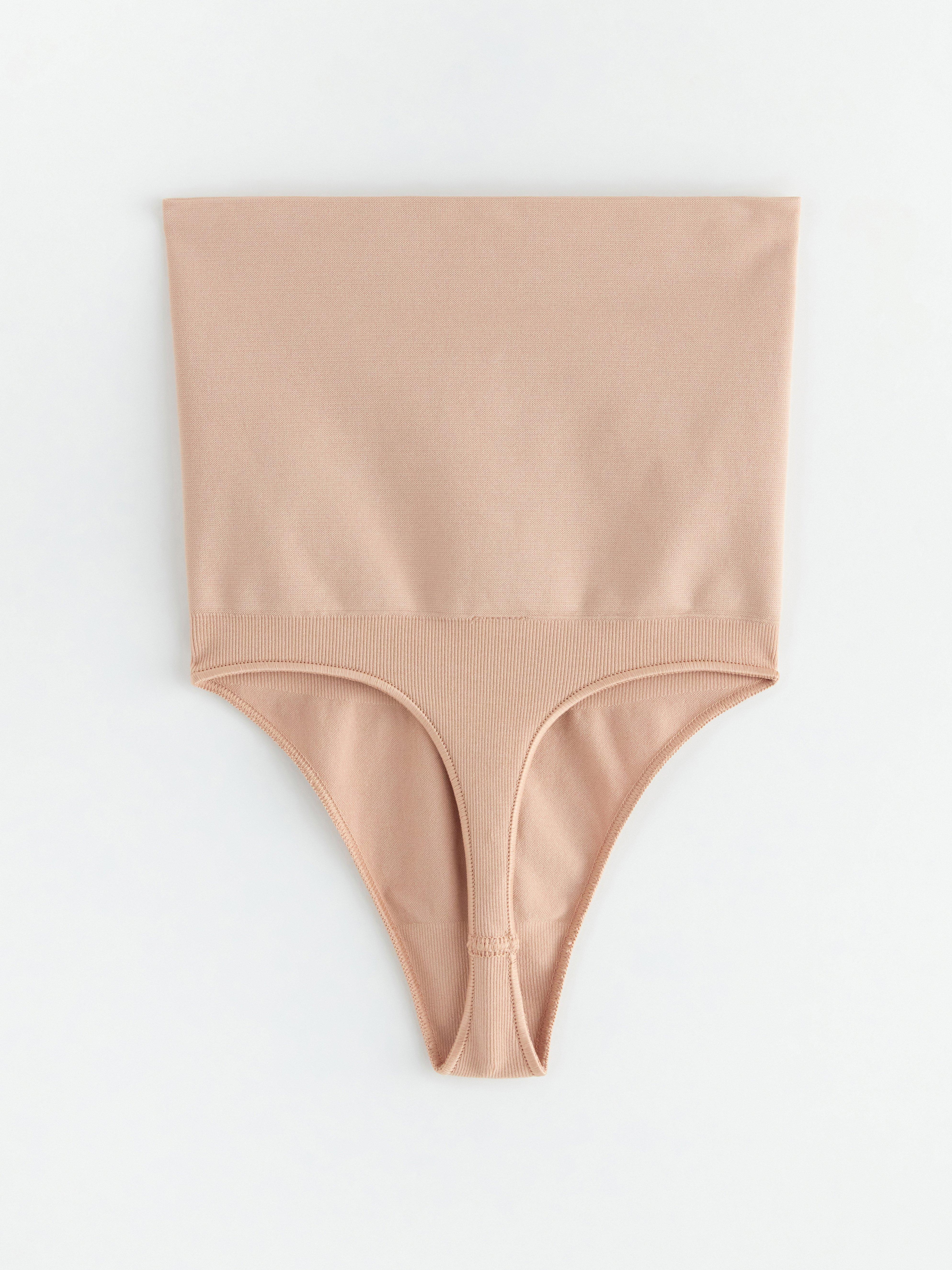 String gainant à maintien zonal beige