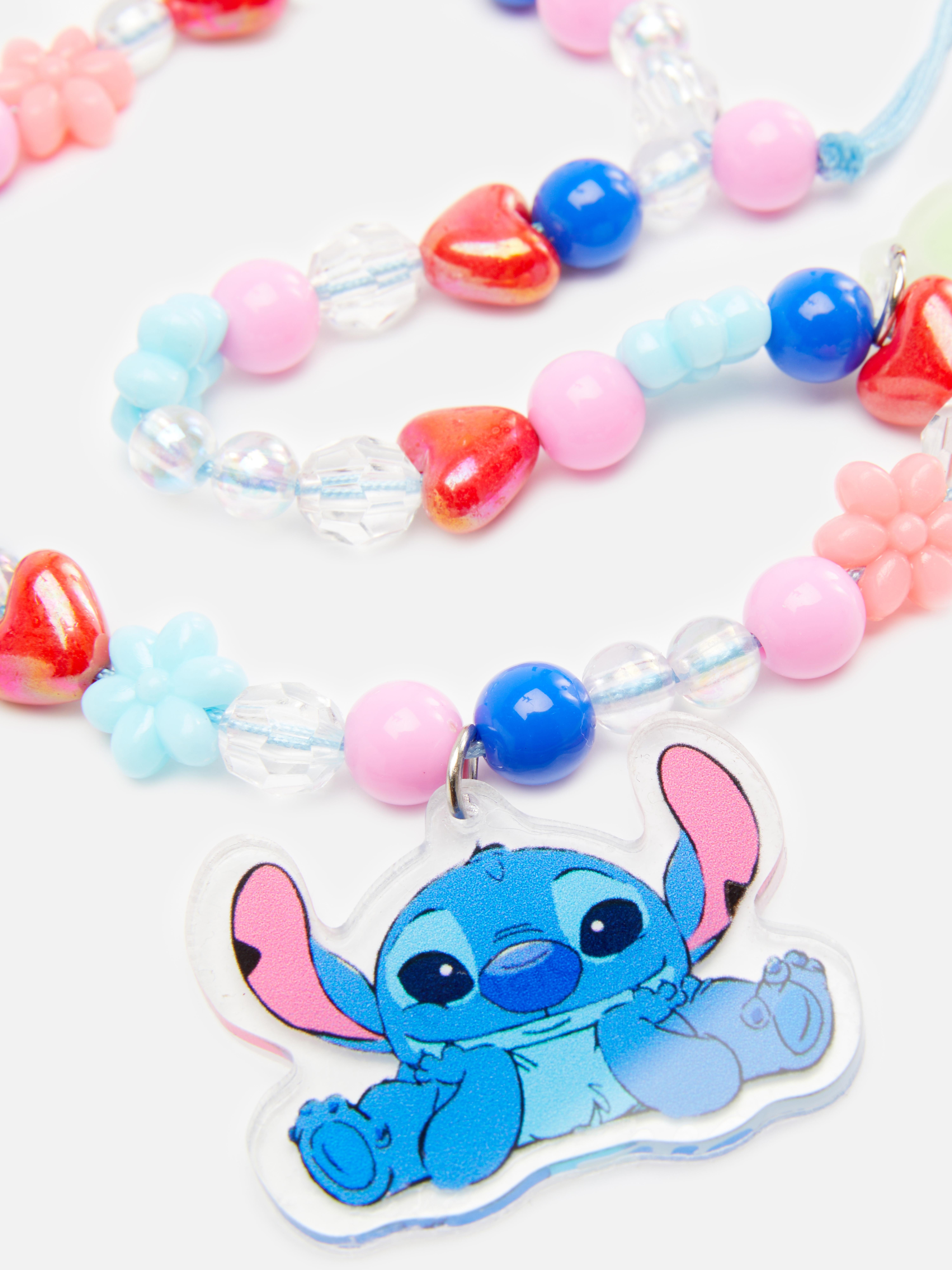 Disney telefono pakabukas „Stitch“. Telefono pakabukas, papuoštas spalvingais karoliukais ir mielu „Stitch“ ženklu.