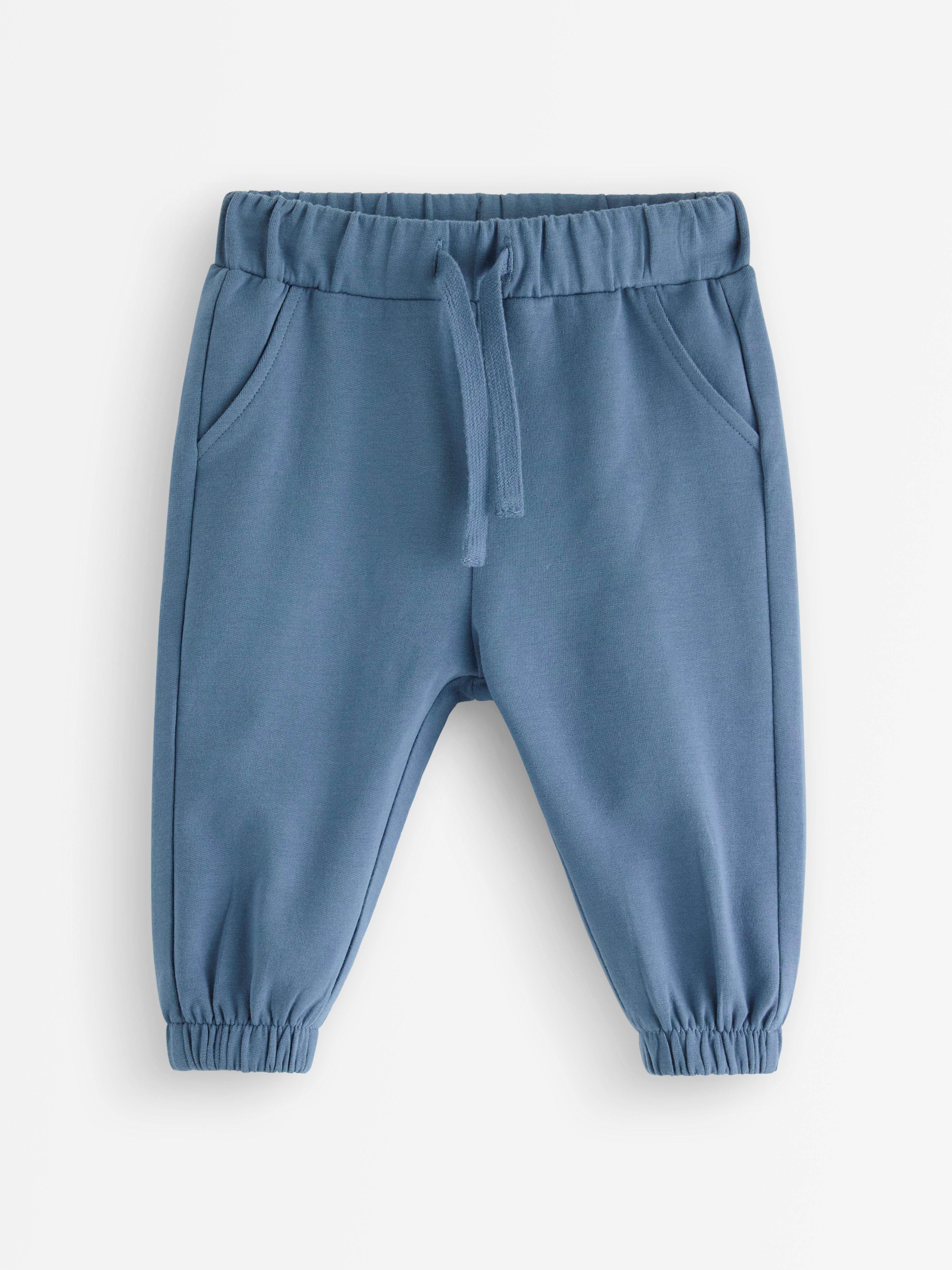 Pantalones deportivos con interior cepillado, color azul oscuro empolvado.