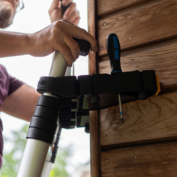 Spacers for telescopic ladders