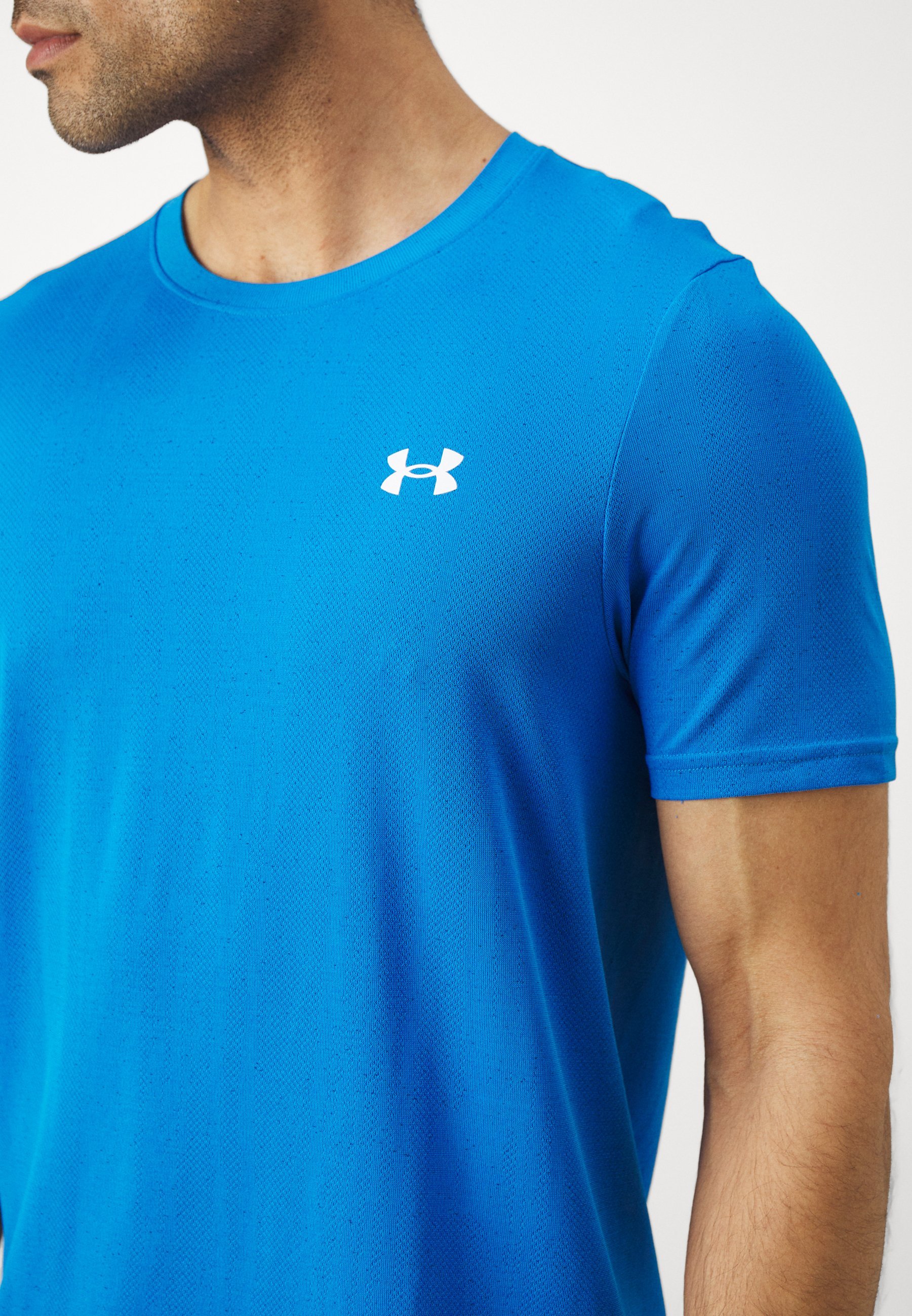 Under Armour VANISH SEAMLESS NOVELTY - T-shirt met print - blauw Atlantis/wit