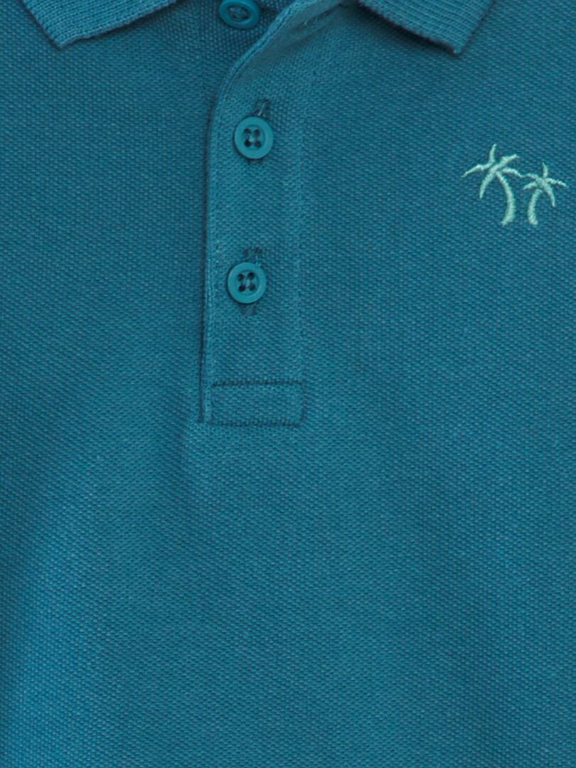 Polo de algodão piqué com estampa de palmeiras - AZUL