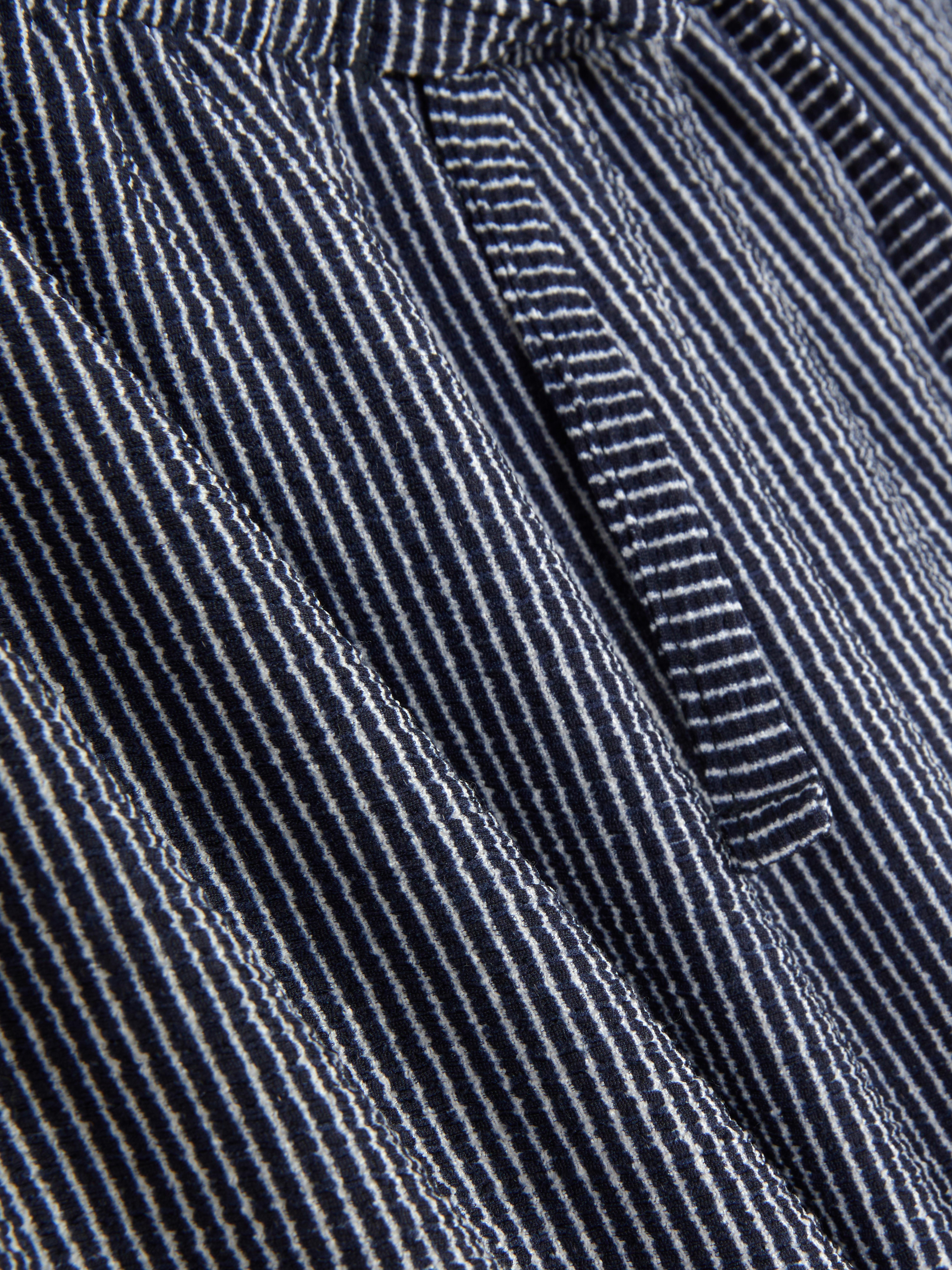 Gestreepte jersey broek Deze broek heeft relaxte wijde pijpen en een tailleband met trekkoord