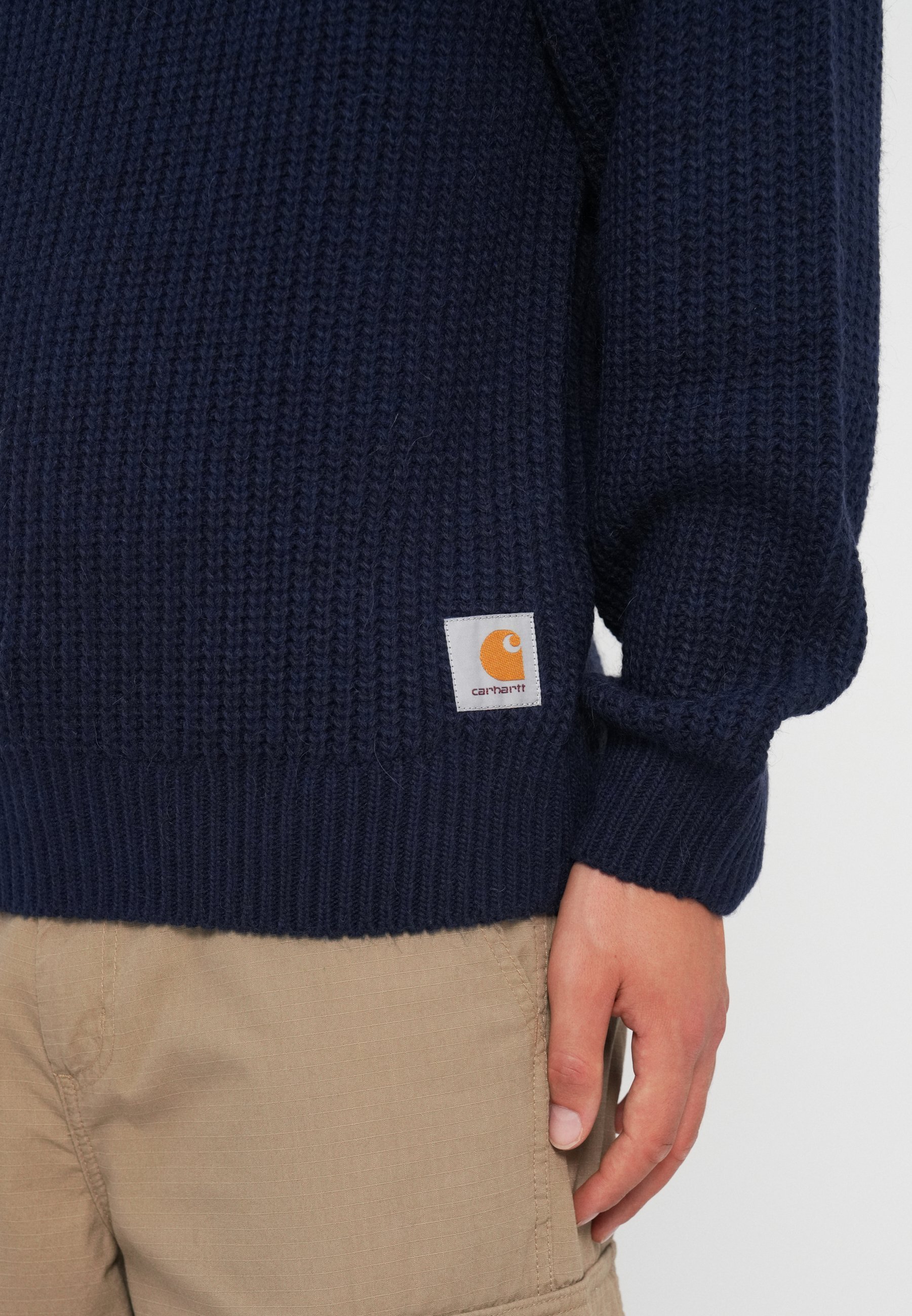 Carhartt gebreide trui in aanbouw