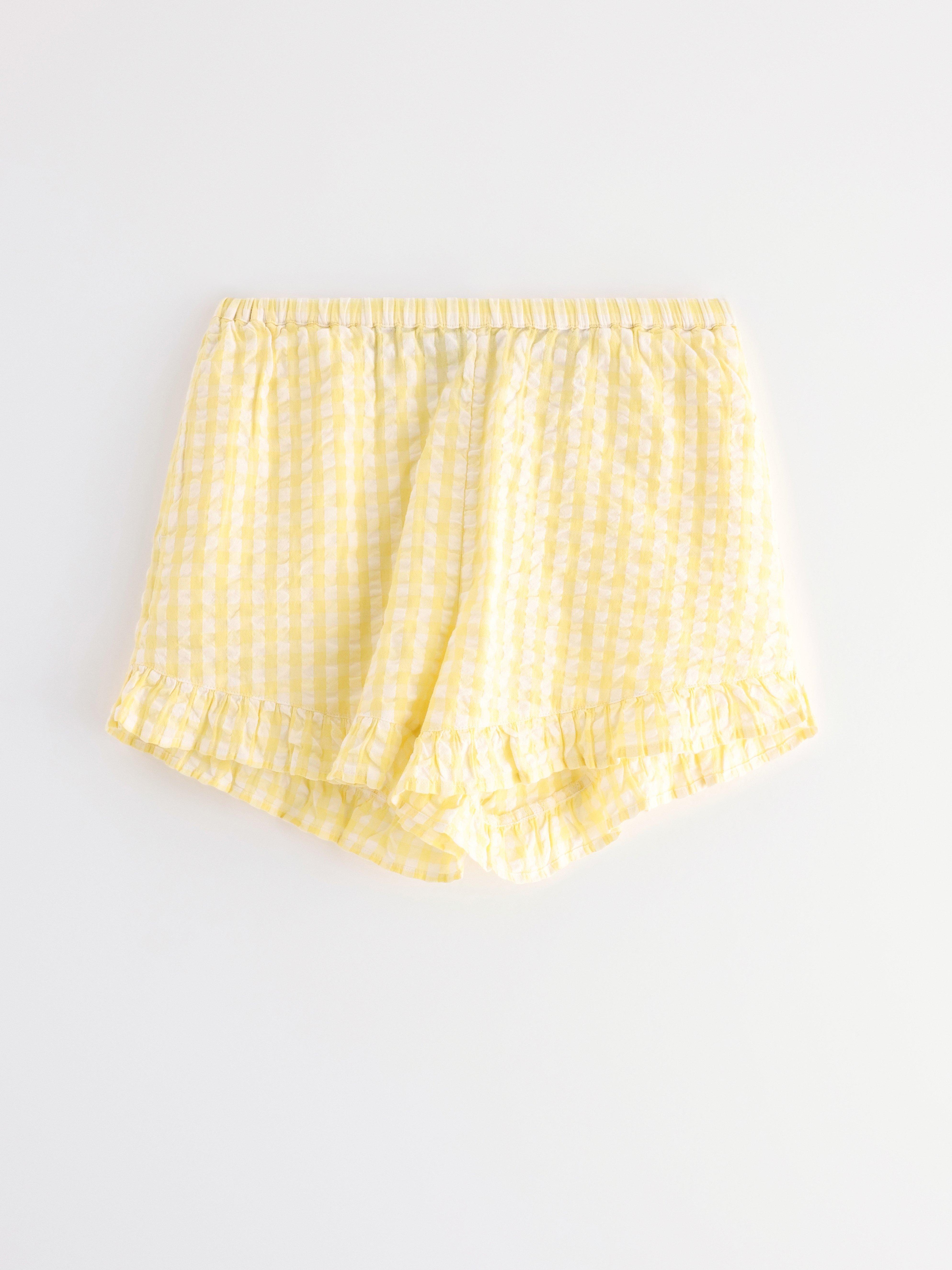 Pyjamasshorts i ryggsekk lys gul