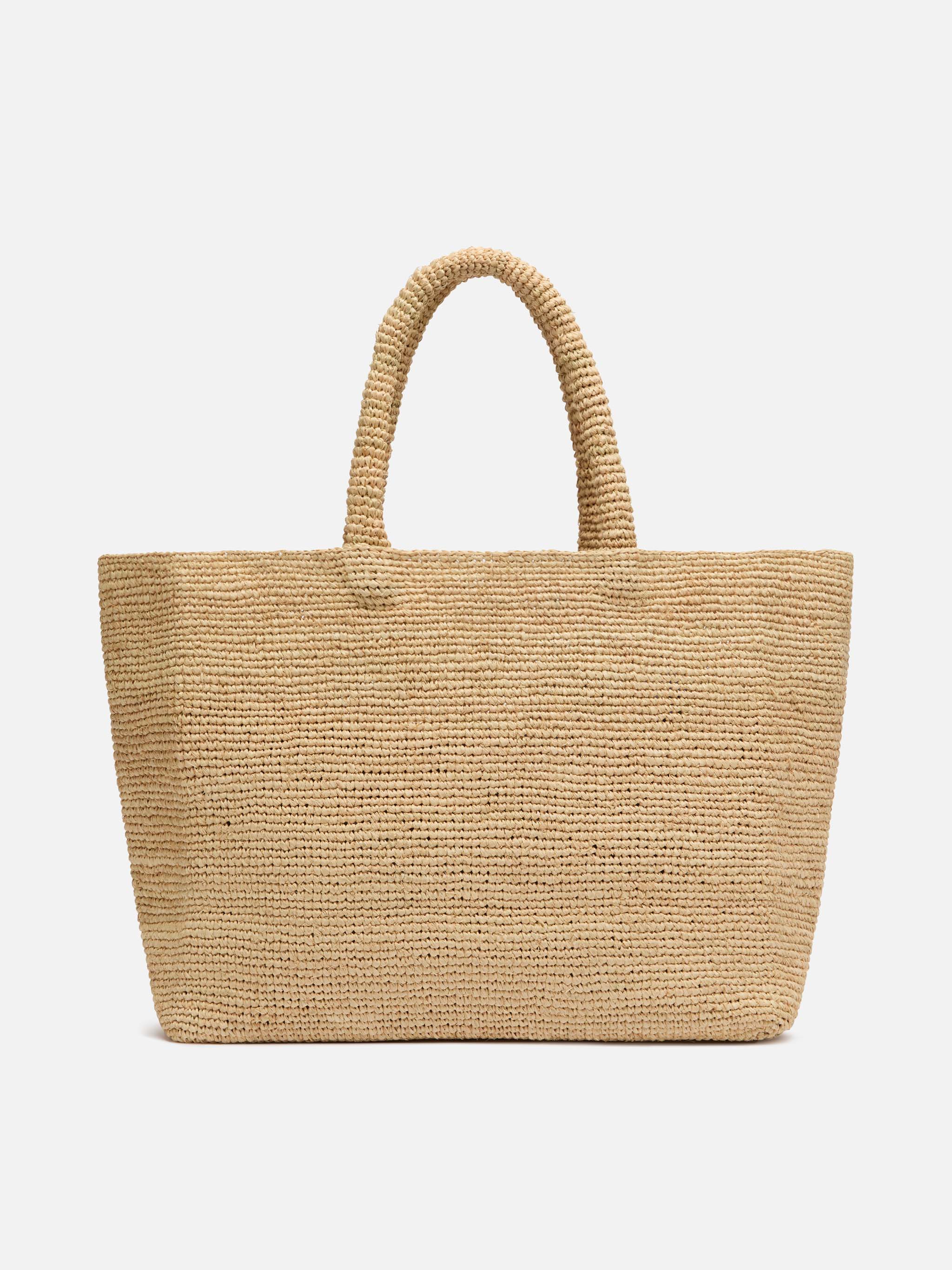 Beige raffia strandtas met katoenen binnenvak en Mykonos-borduurwerk.