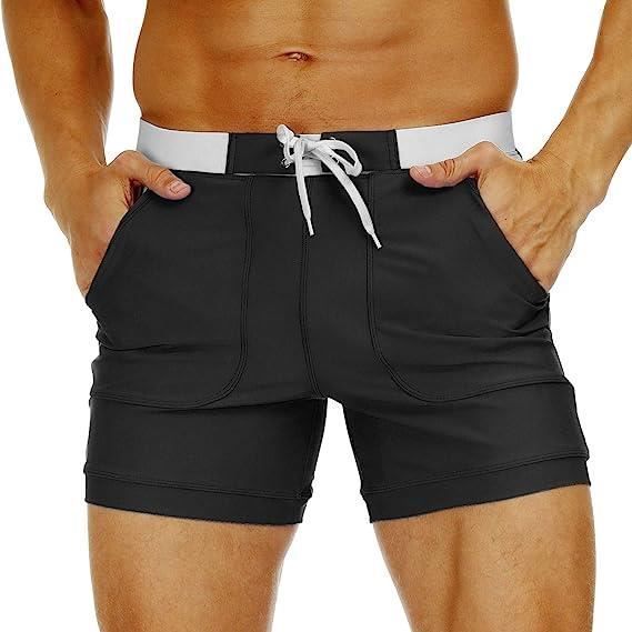 Calção de banho masculino com bolsos, cintura elástica e cordão, estilo esportivo, corte slim, preto.