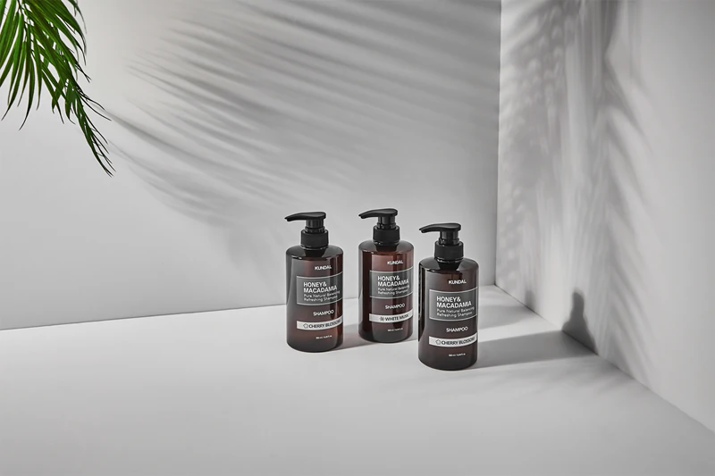 Shampoo natural KUNDAL com mel e almíscar branco de macadâmia para cabelos secos e danificados.