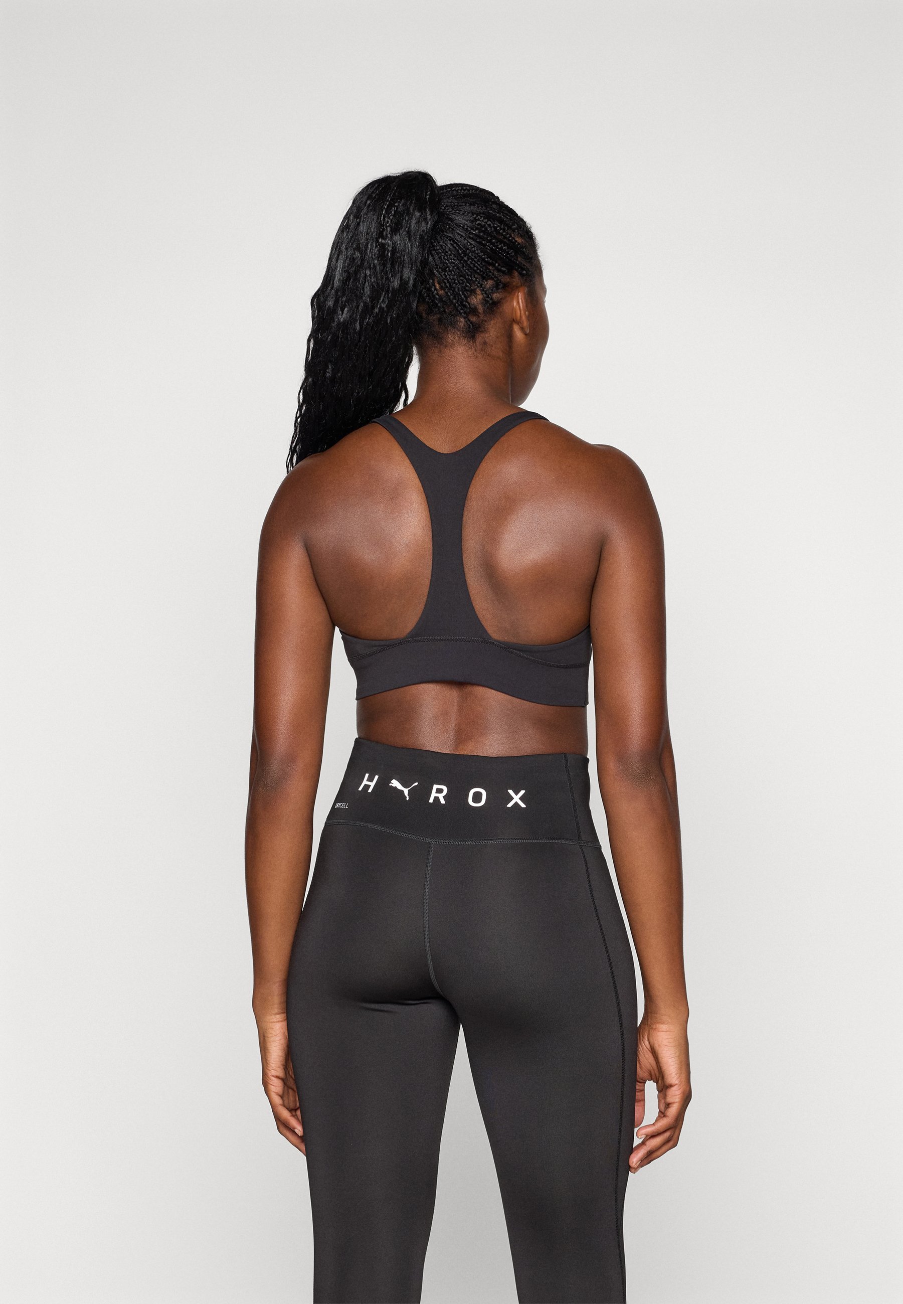 Puma HYROX SHAPELUXE HIGH NECK BRA - Keskmise toestusega spordirinnahoidja - must