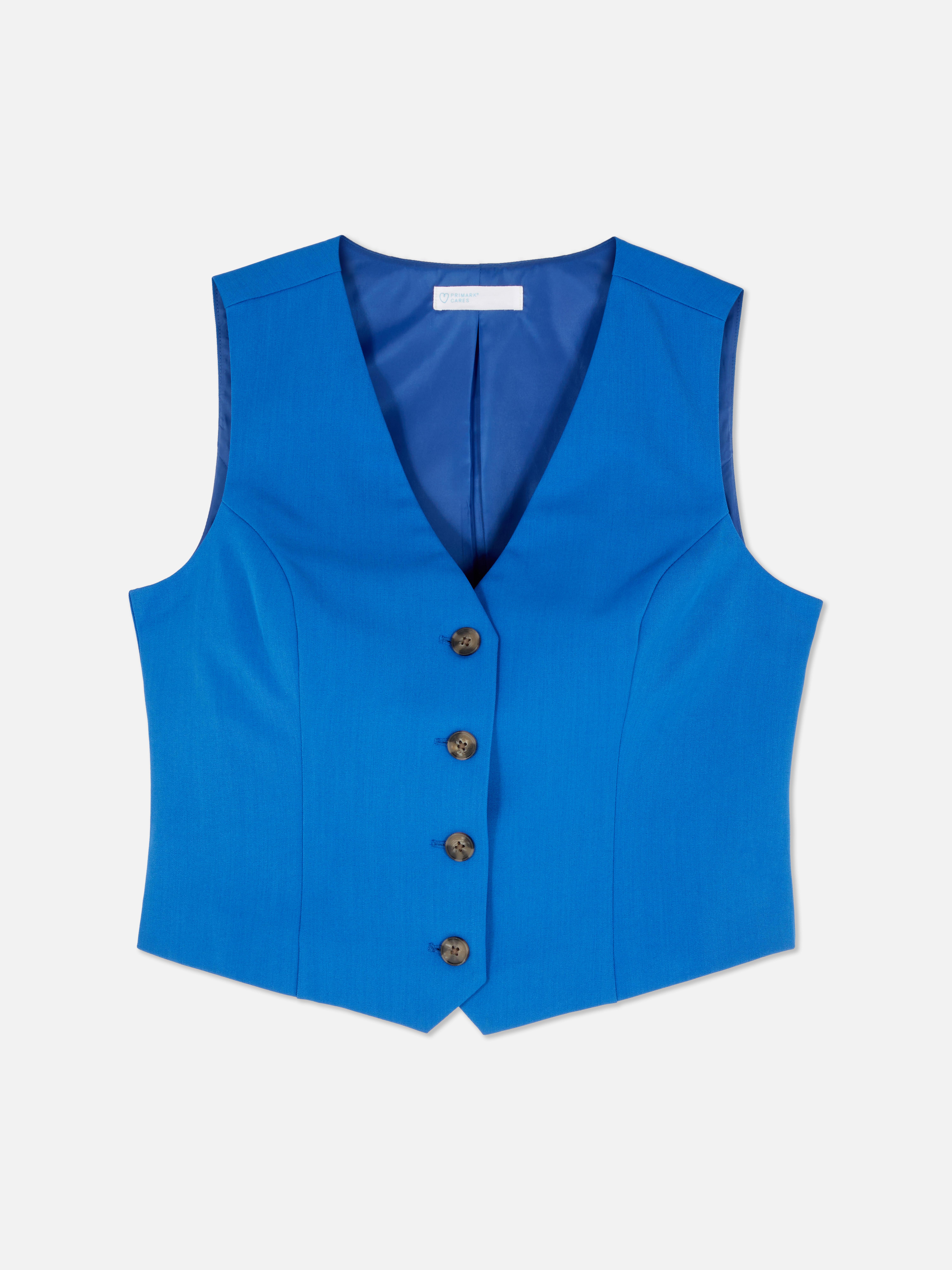 Vestă elegantă cu închidere cu nasturi. Această vestă atemporală, cu cusături prințesă, închidere cu nasturi și decolteu în V, este un adevărat must-have.
