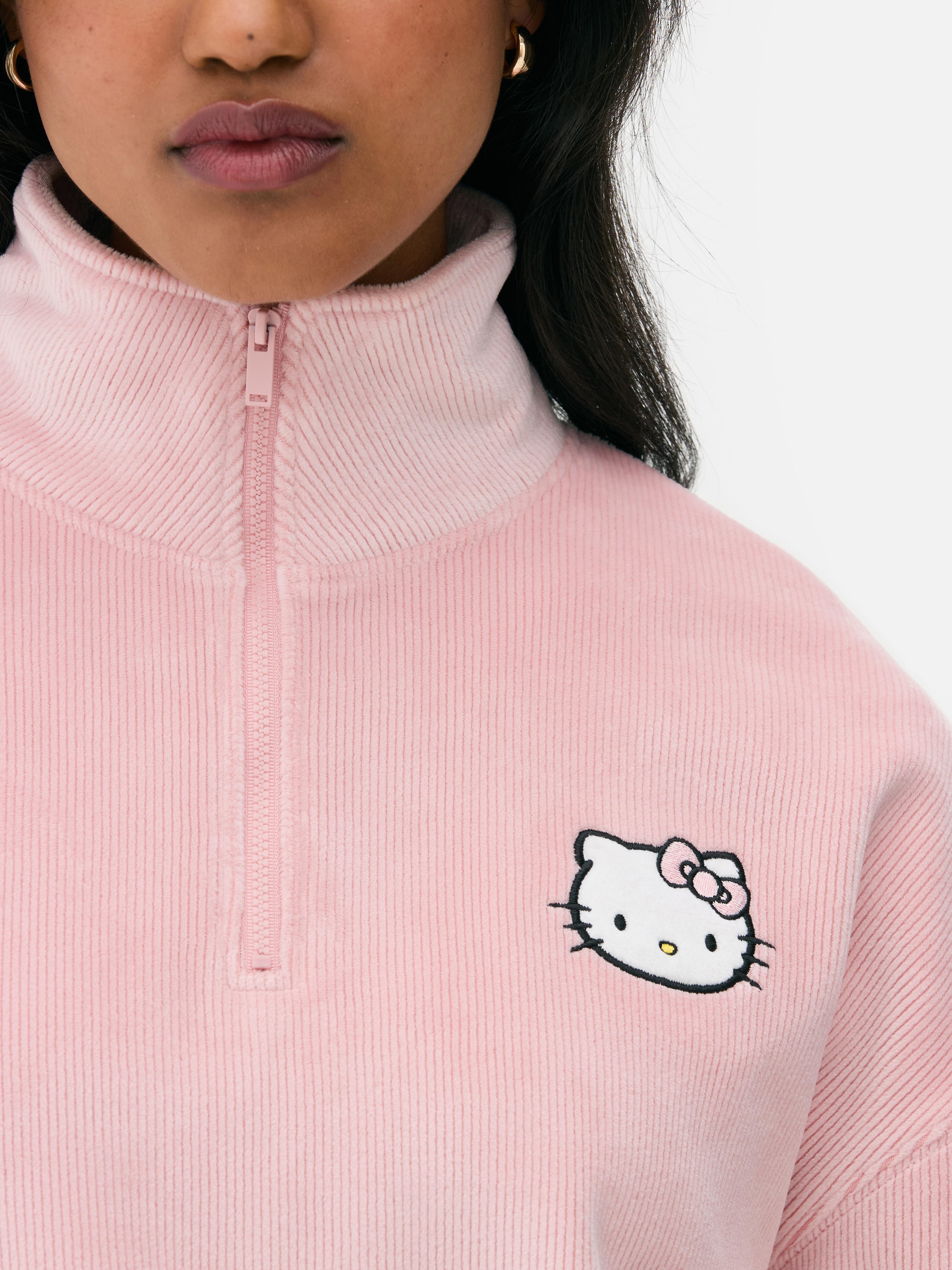 Bluza welurowa Hello Kitty Bluza welurowa Hello Kitty z zamkiem błyskawicznym o długości 1/4 i długimi rękawami