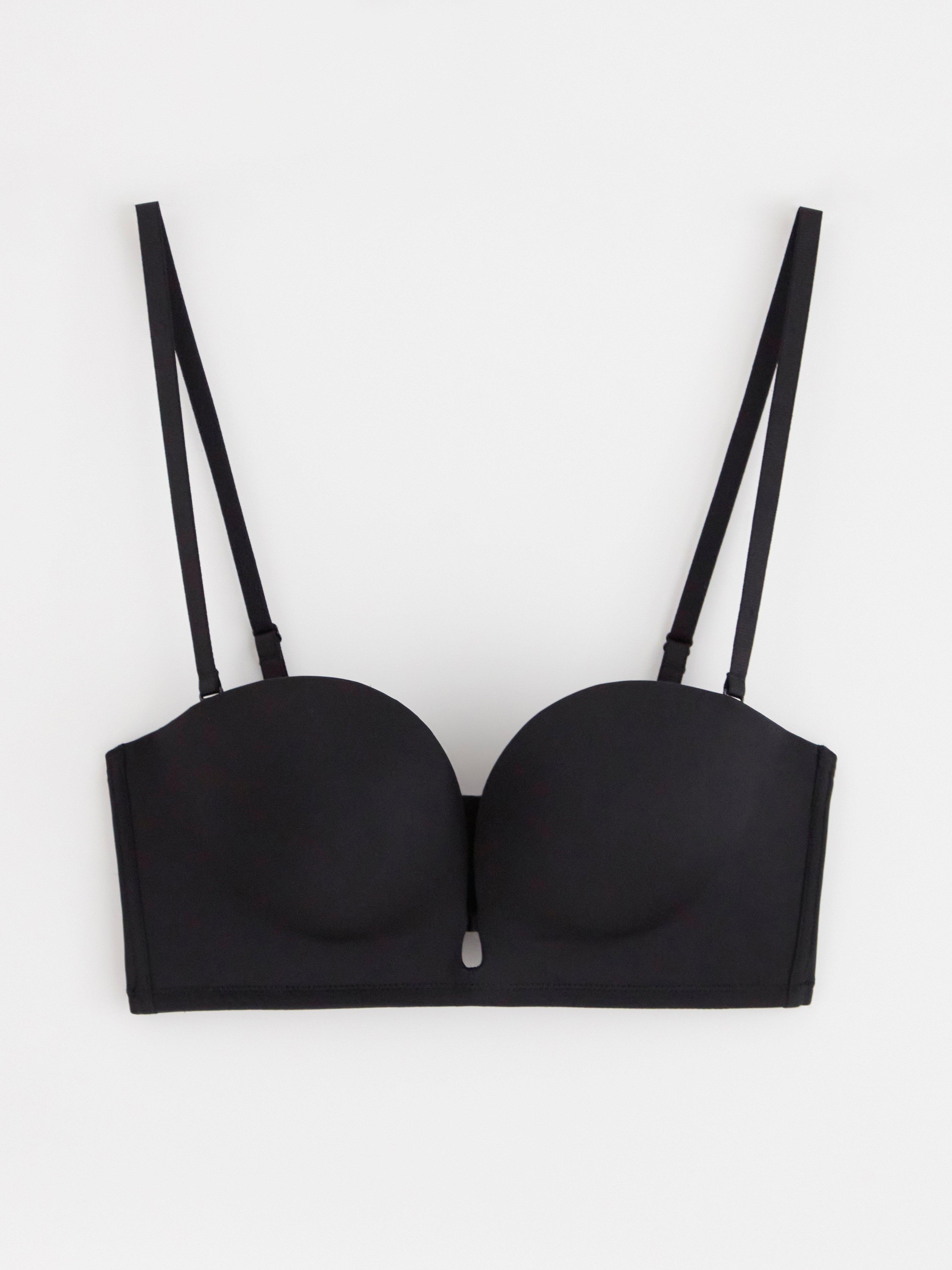 Sujetador push-up sin tirantes con escote pronunciado, color negro.