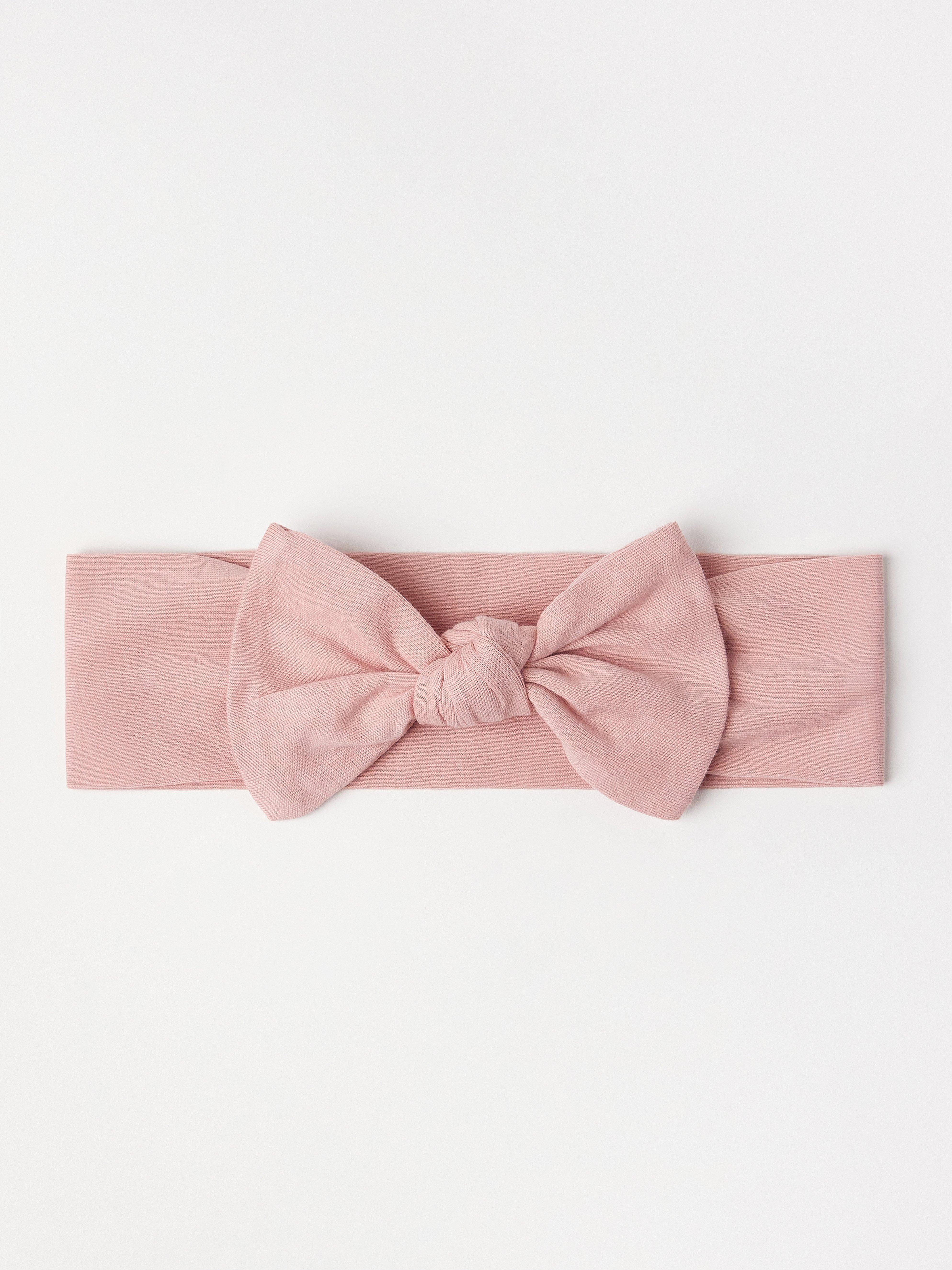Tiara com laço grande rosa-claro