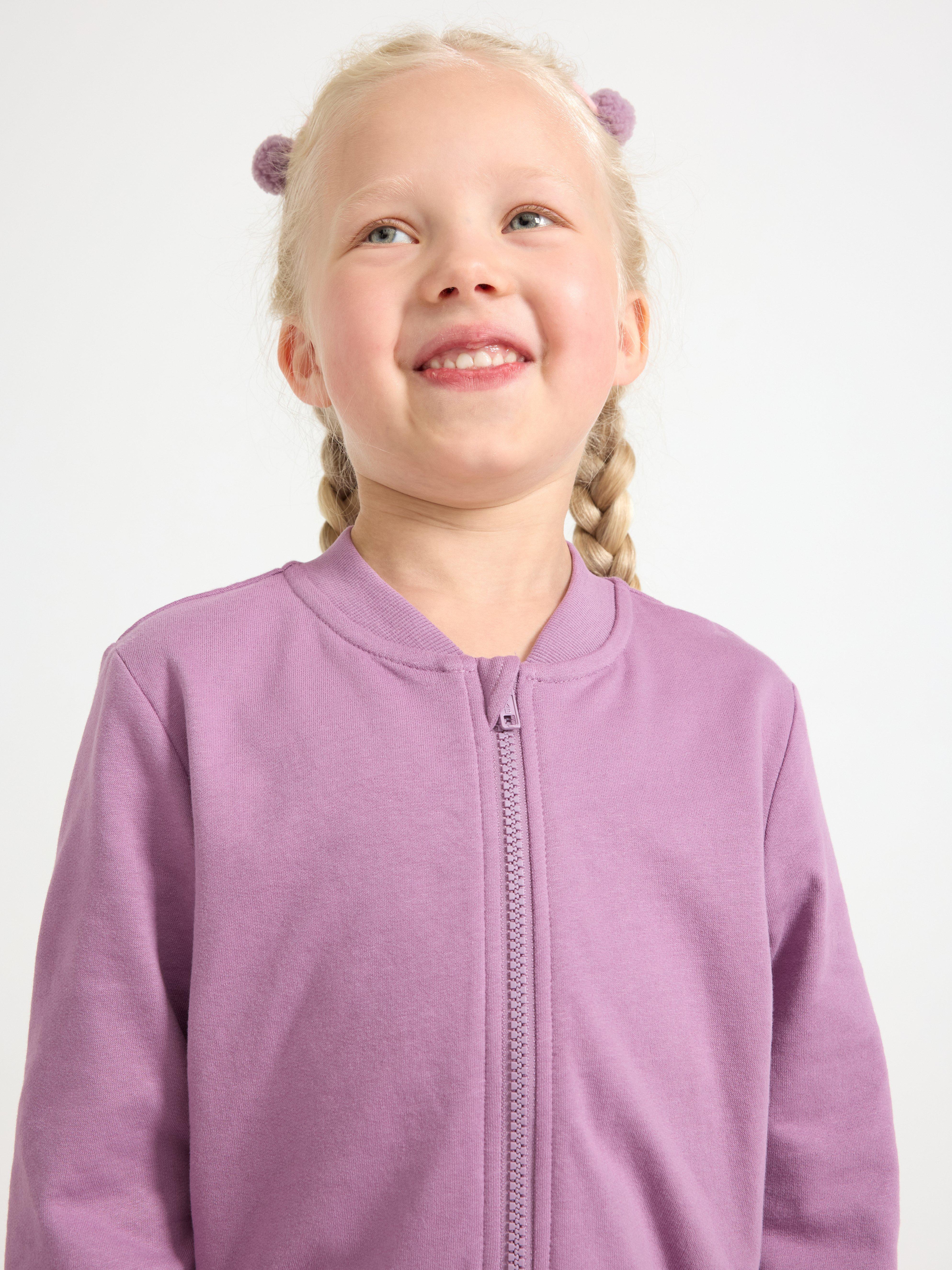 Sudadera con cremallera color lila claro empolvado