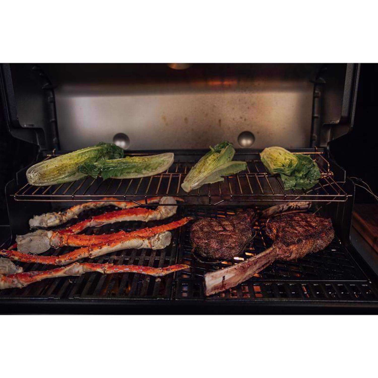Churrasqueira a gás propano Weber Genesis E-335 com 3 queimadores, cor azul oceano profundo.