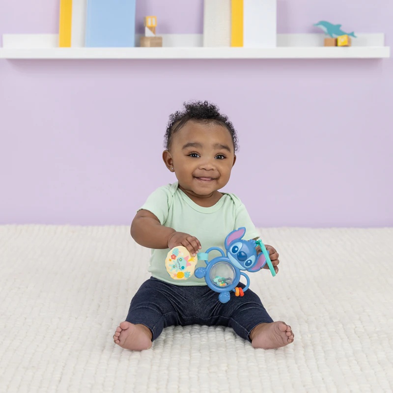 Izobraževalna igrača Bright Starts Stitch Tummy Tumble