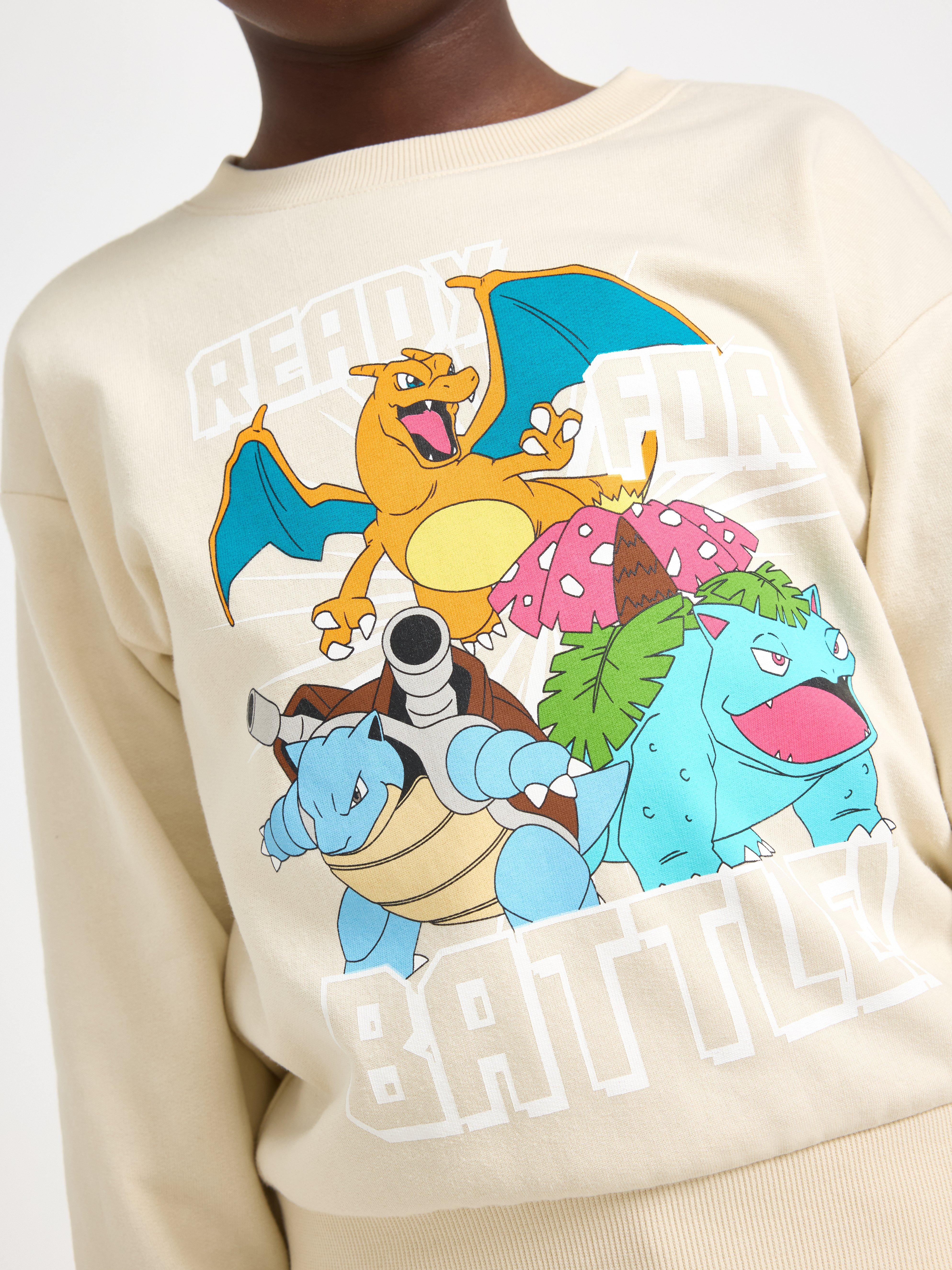 Sudadera Pokémon color beige claro