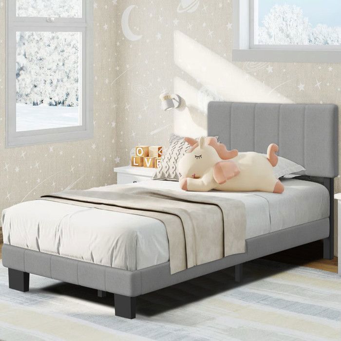 Cama infantil de 90 x 200 cm con somier de láminas incluido, estructura moderna, cabecero regulable en altura, color gris.