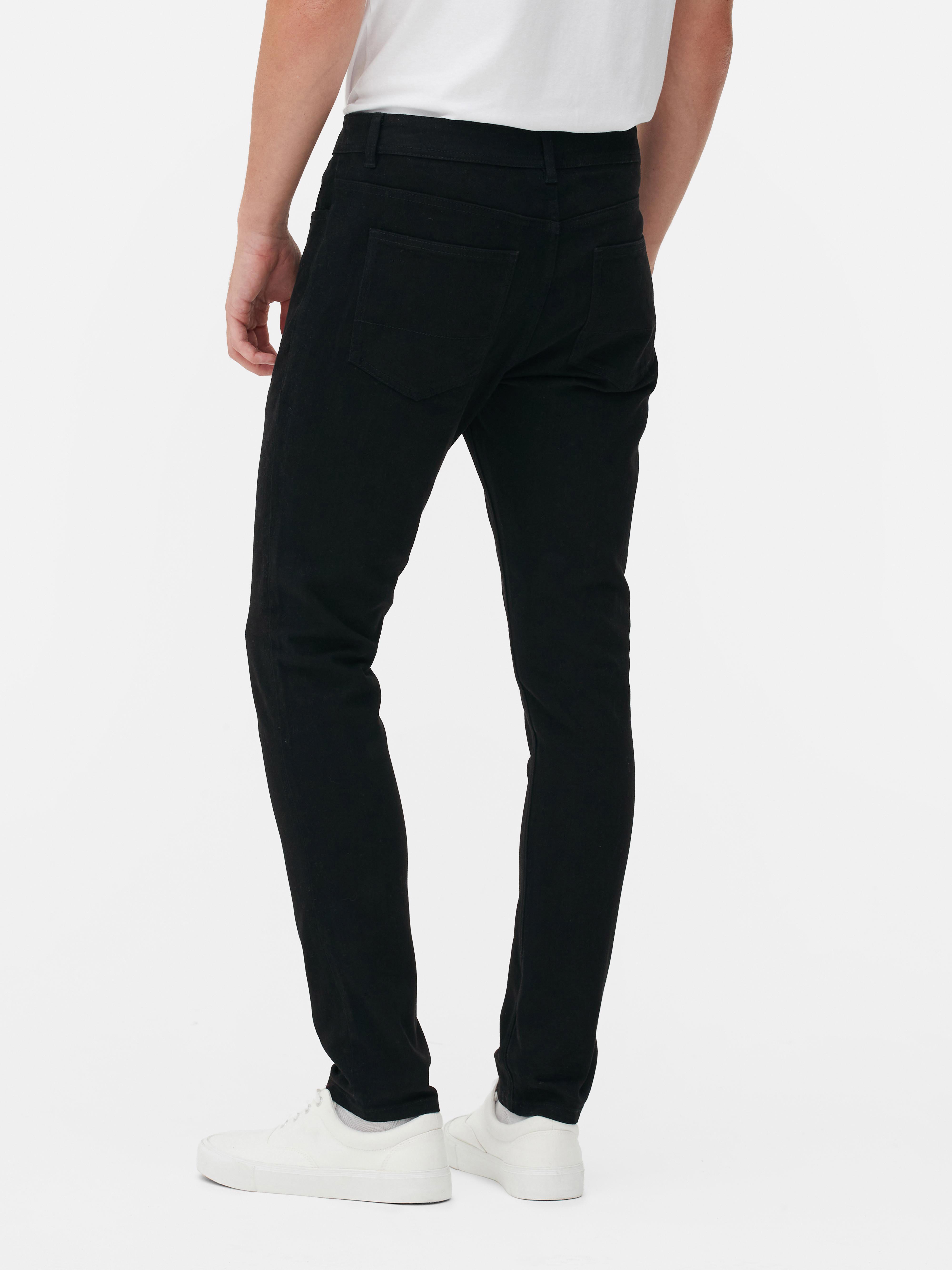 Pantaloni skinny din bumbac twill. Acești pantaloni skinny din bumbac twill prezintă elemente clasice, precum cinci buzunare și găici pentru curea.