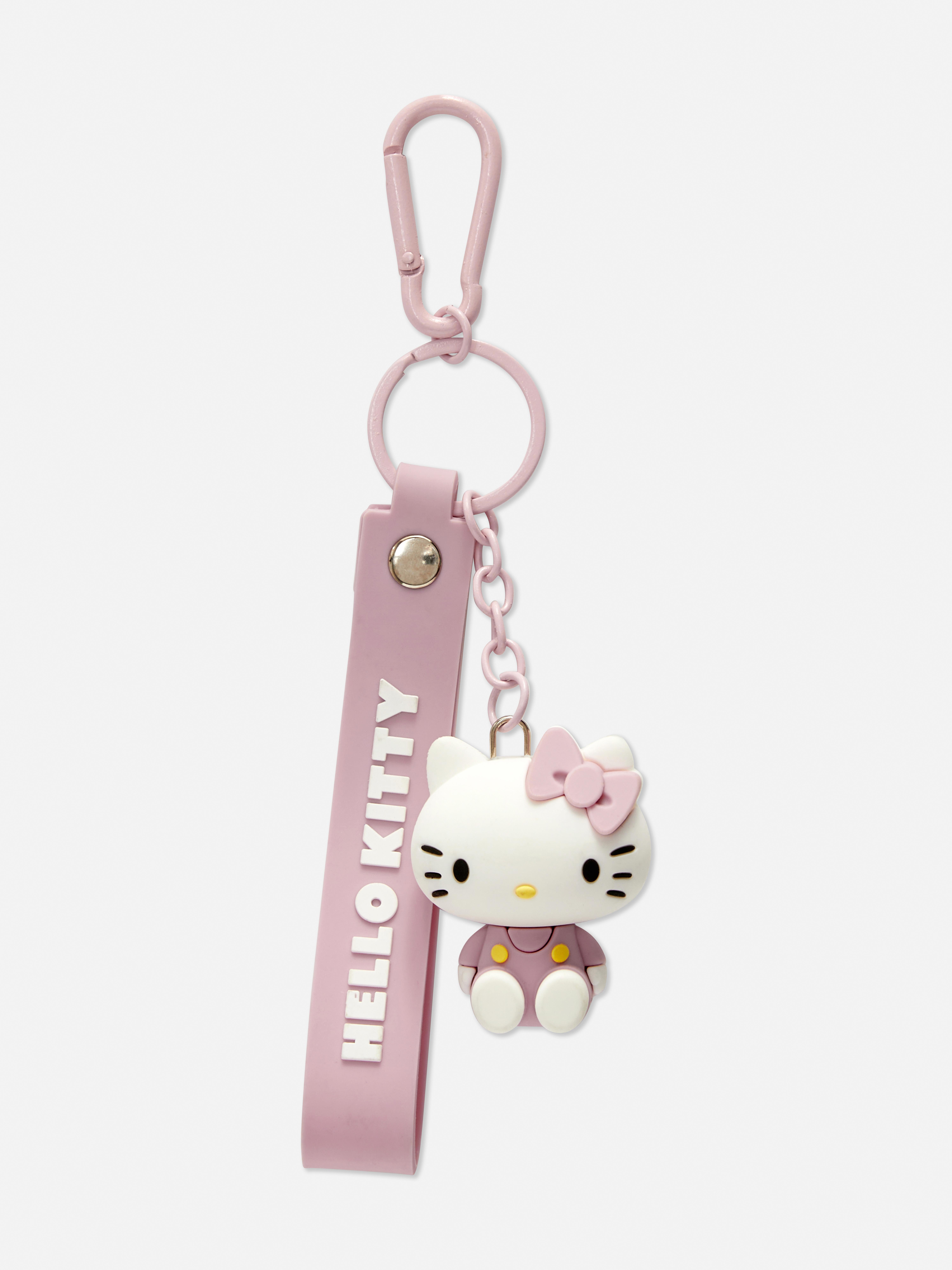 Breloc de călătorie Hello Kitty Un breloc de călătorie cu pandantiv și etichetă cu nume Hello Kitty