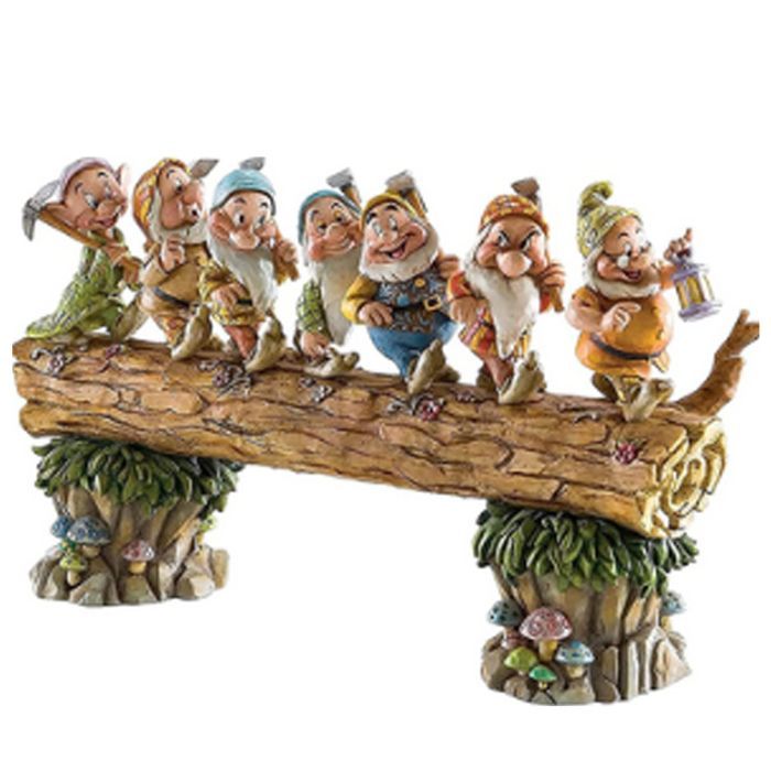 Seven dwarf trees decorate the garden, a miniature resin statue of a dwarf.