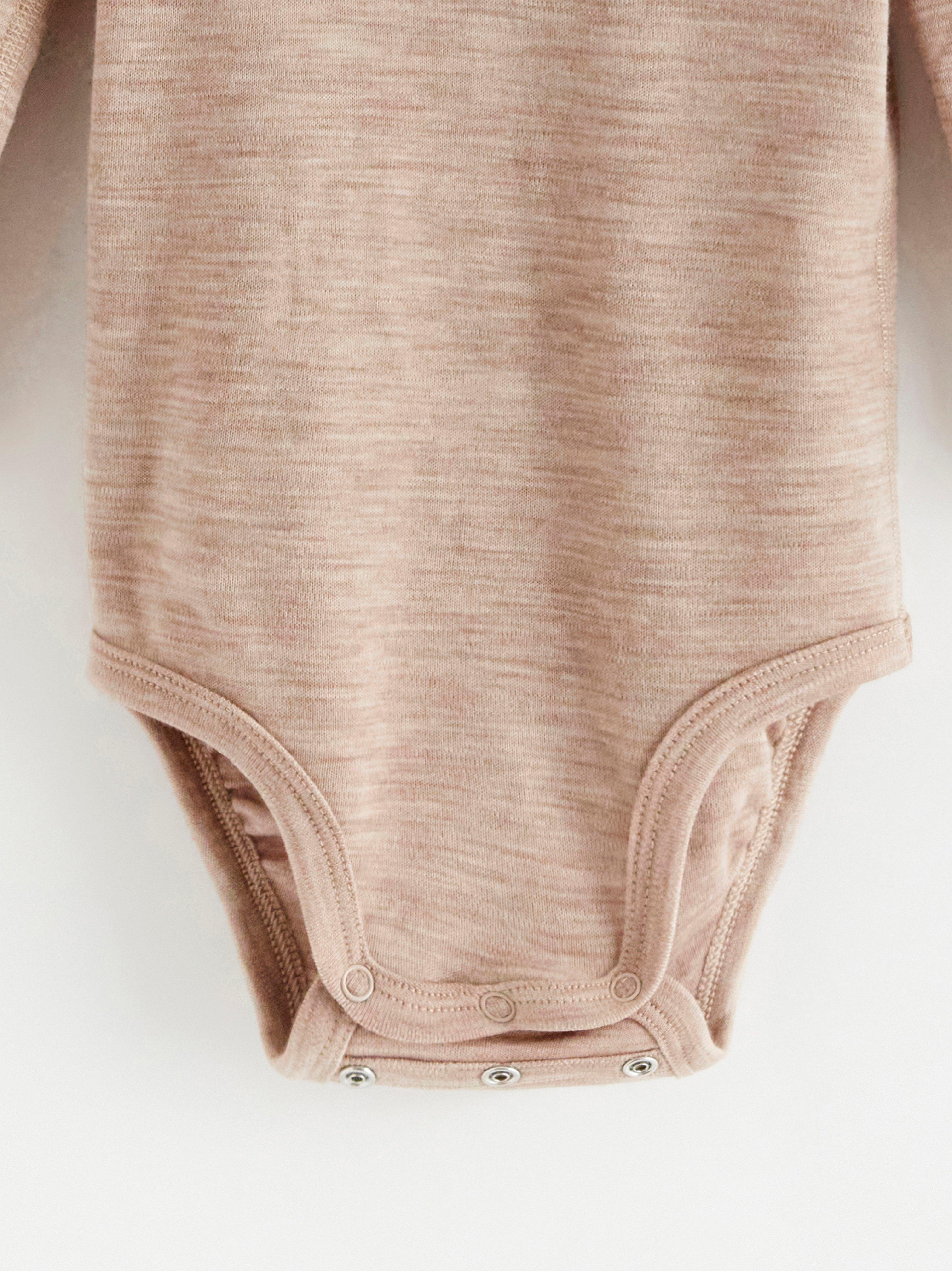 Långärmad body i merinoull Light Beige Melange