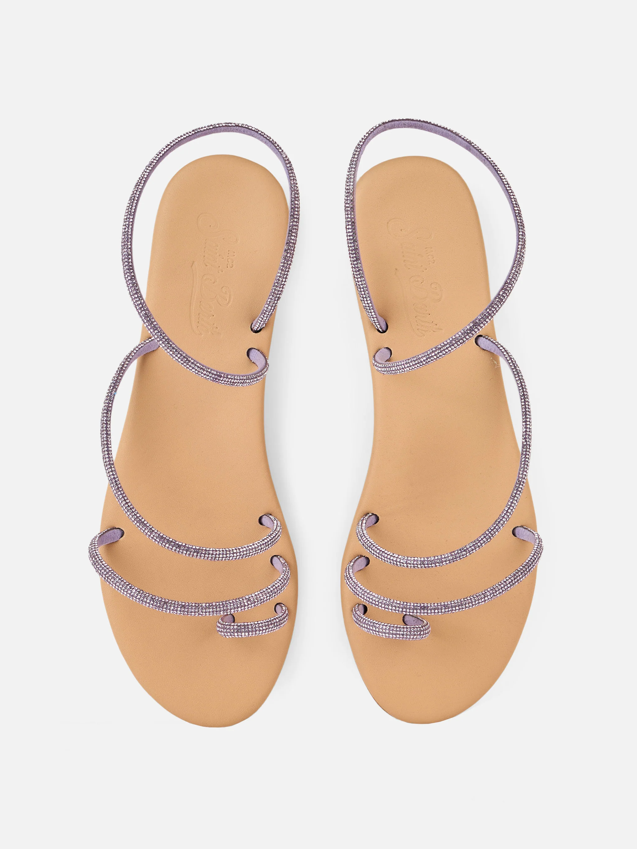 Platte sandalen met ring en lila strass-steentjes