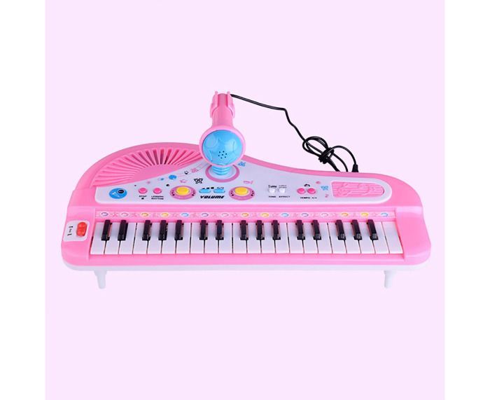 Piano electrónico de 37 teclas con micrófono para niños que aprenden a tocar un instrumento musical.