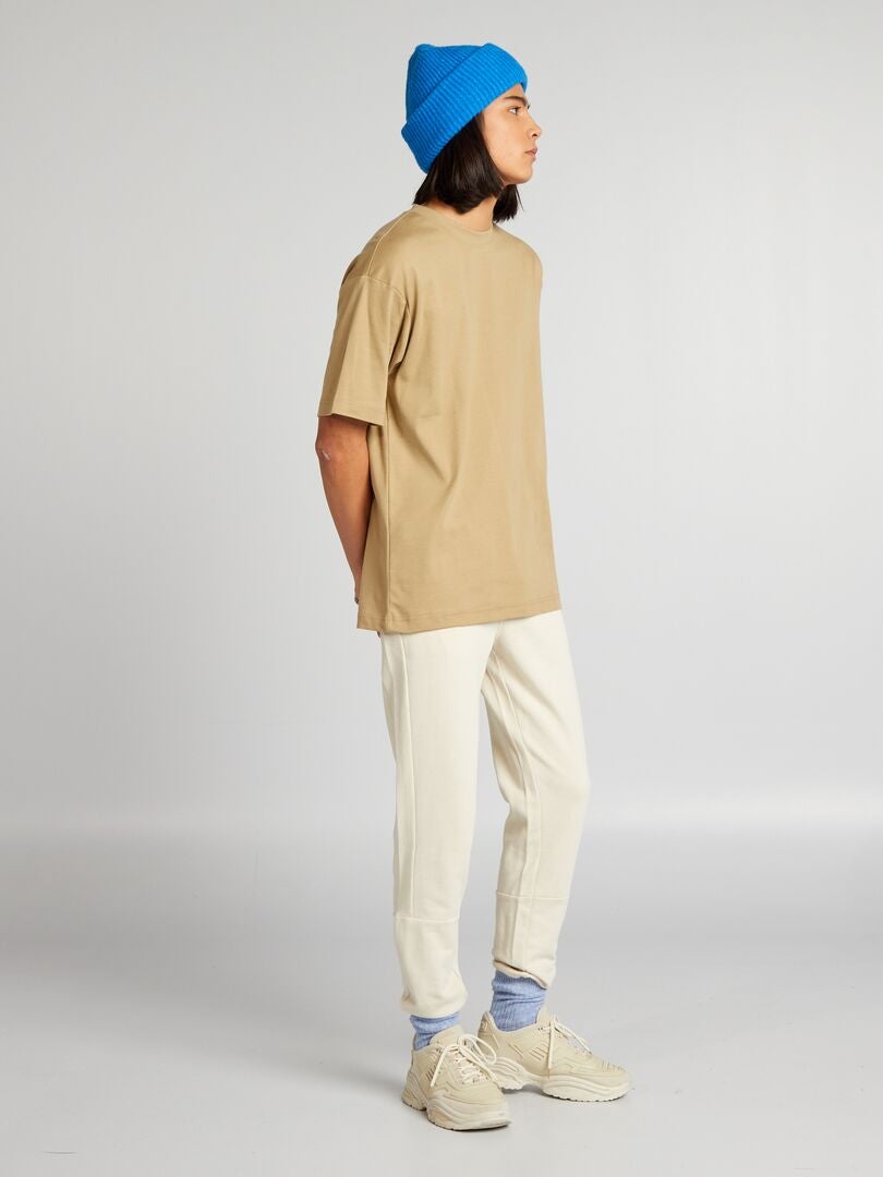Pantalones deportivos con detalles en contraste - beige