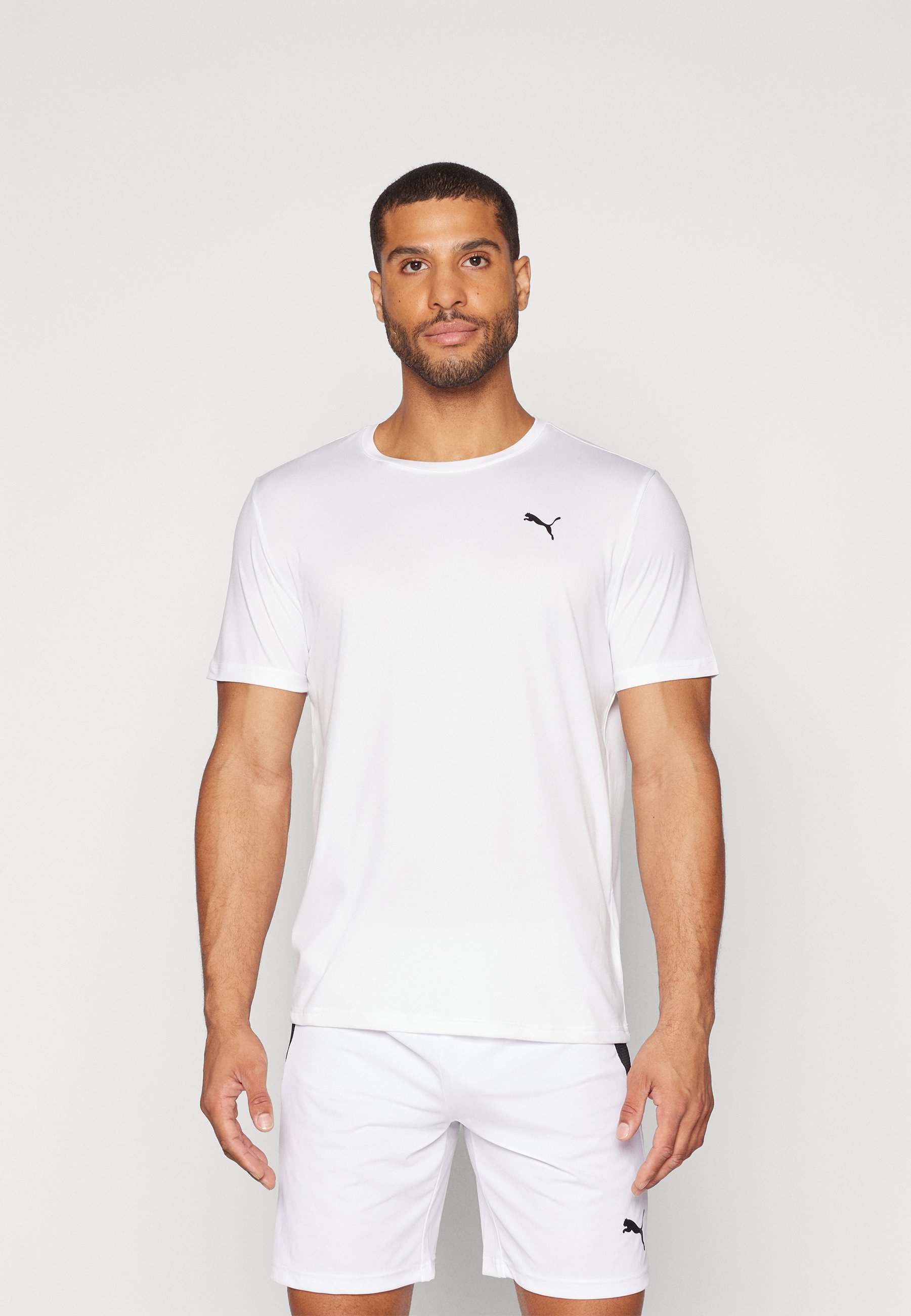 Puma ESSENTIALS SOLID CAT TEE - Sport T-shirt - wit