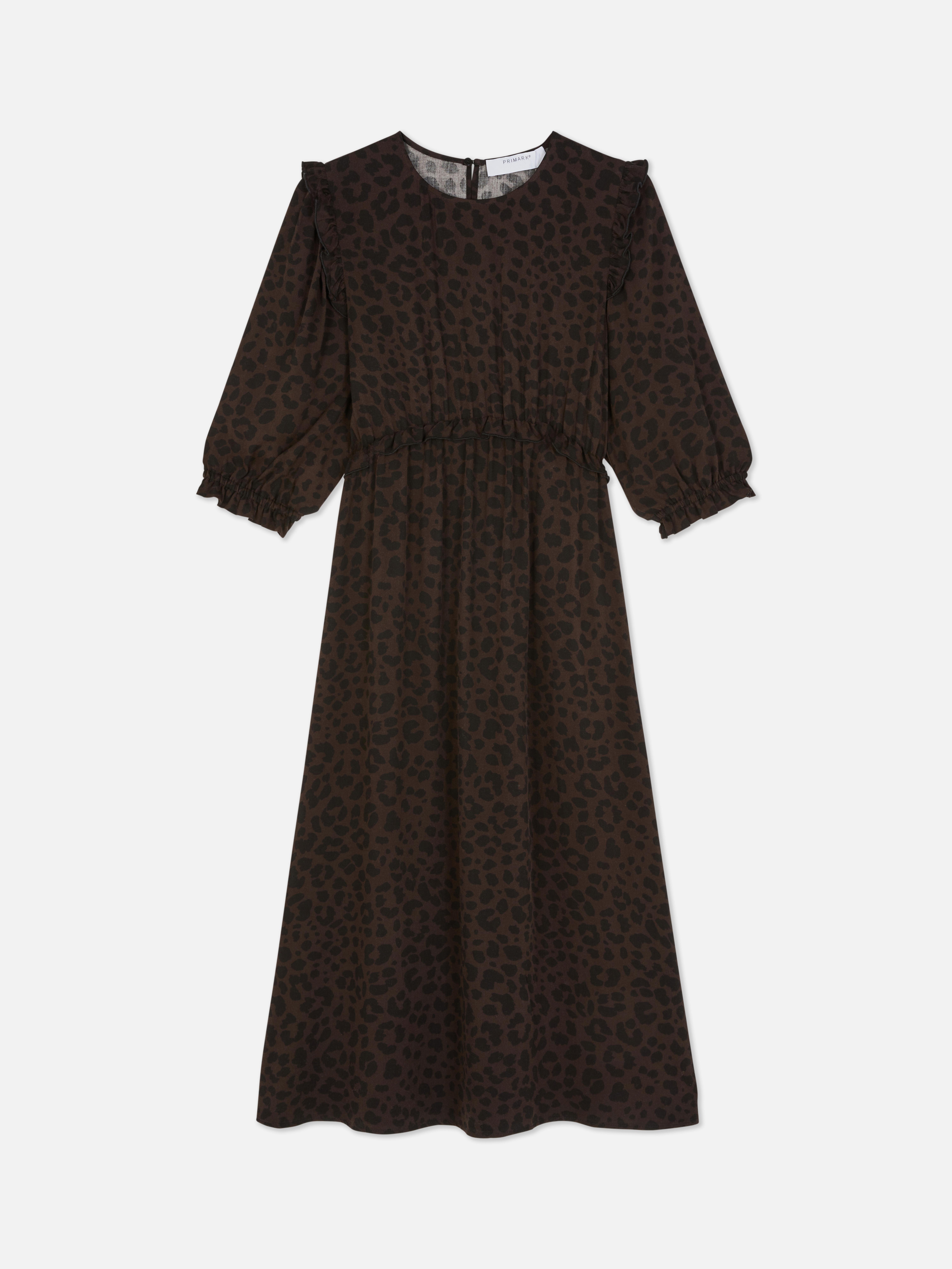 Rochie midi cu volane Această rochie midi cu imprimeu este perfectă pentru iubitoarele de volane