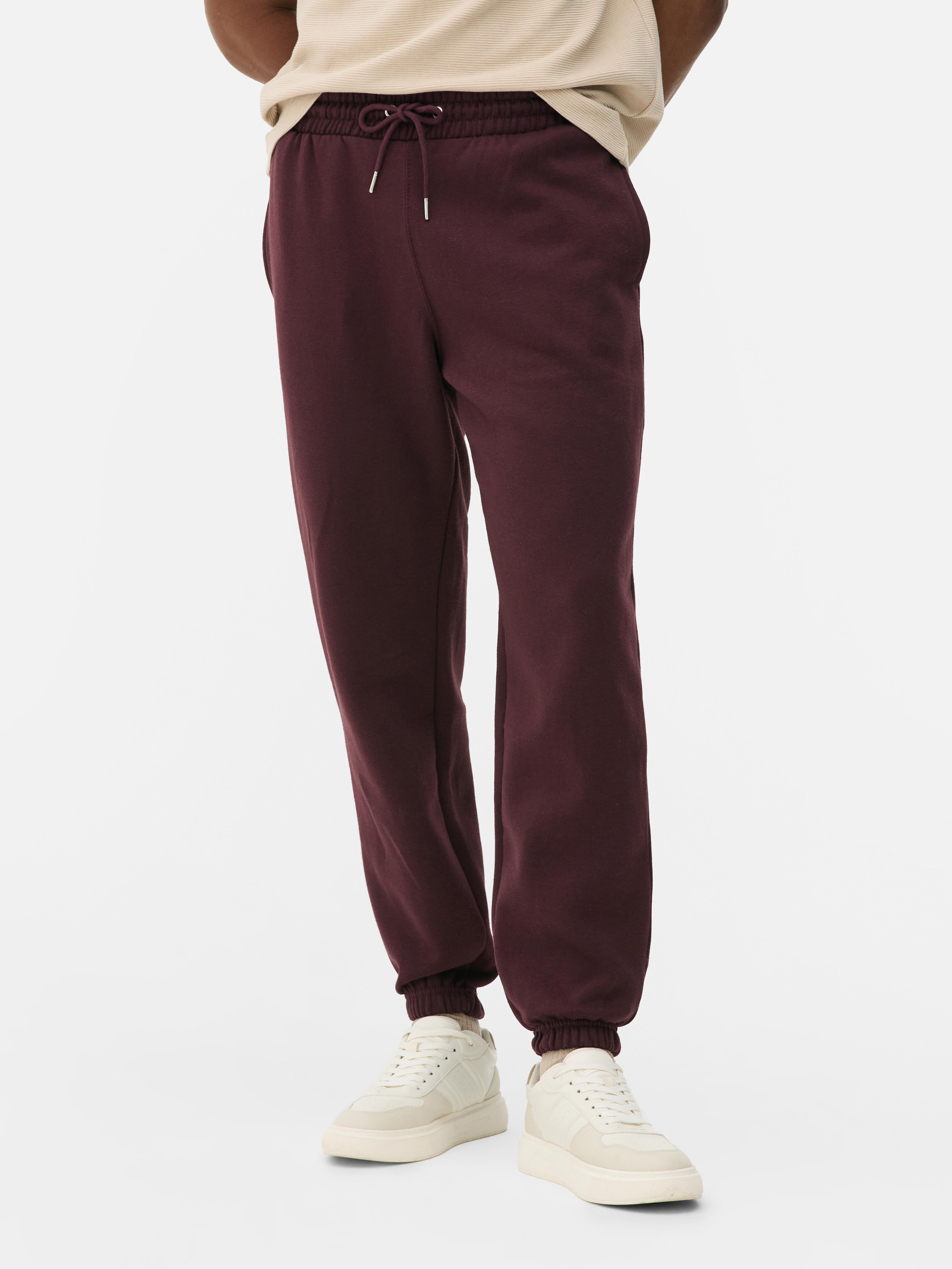 Pantaloni de jogging esențiali cu șnur de strângere Acești pantaloni de jogging confortabili cu șnur de strângere și buzunar aplicat la spate sunt casual și potriviți pentru relaxare