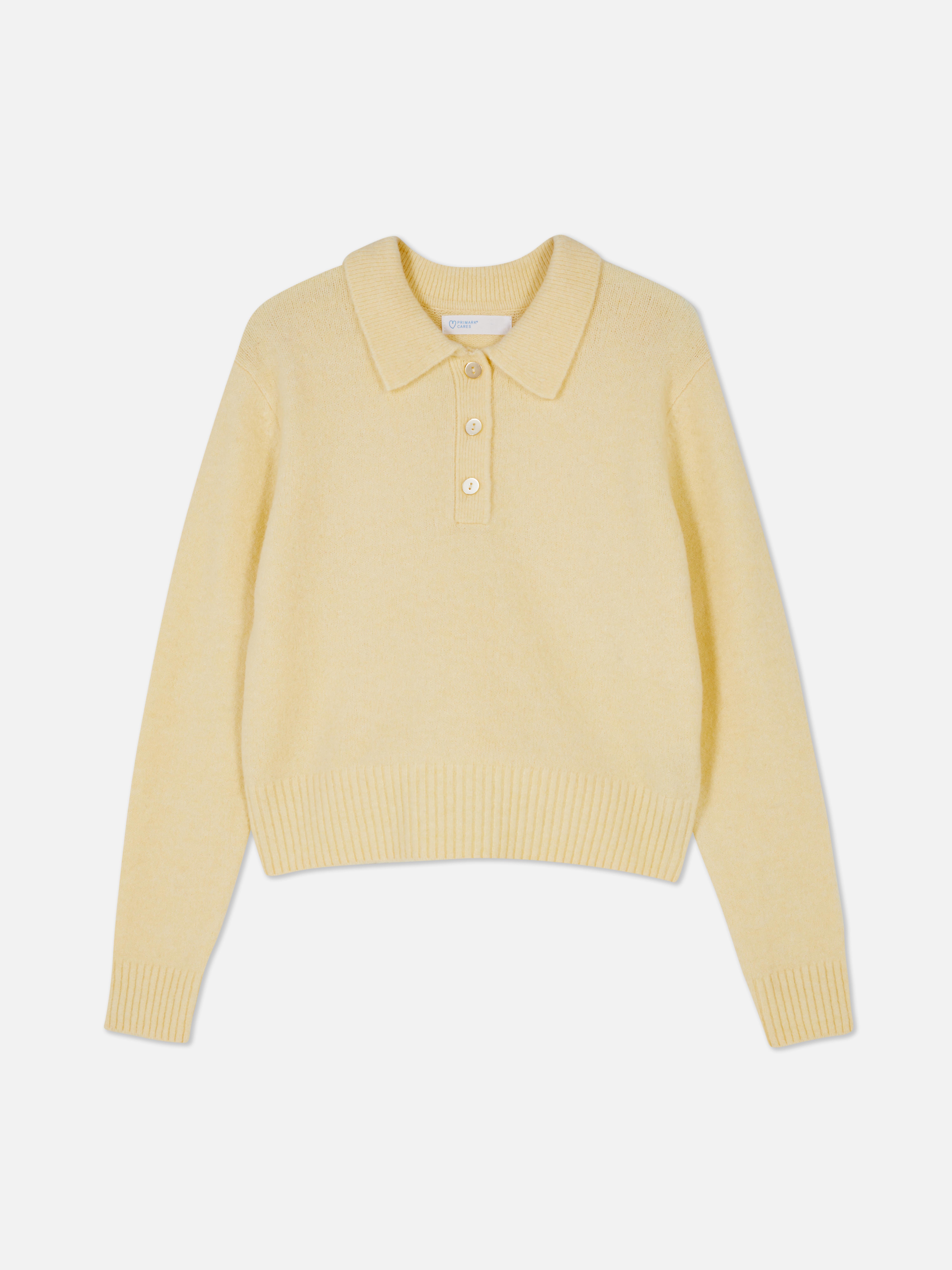Genser med polokrage En myk genser med polokrage og knappestolpe for et komfortabelt, preppy utseende