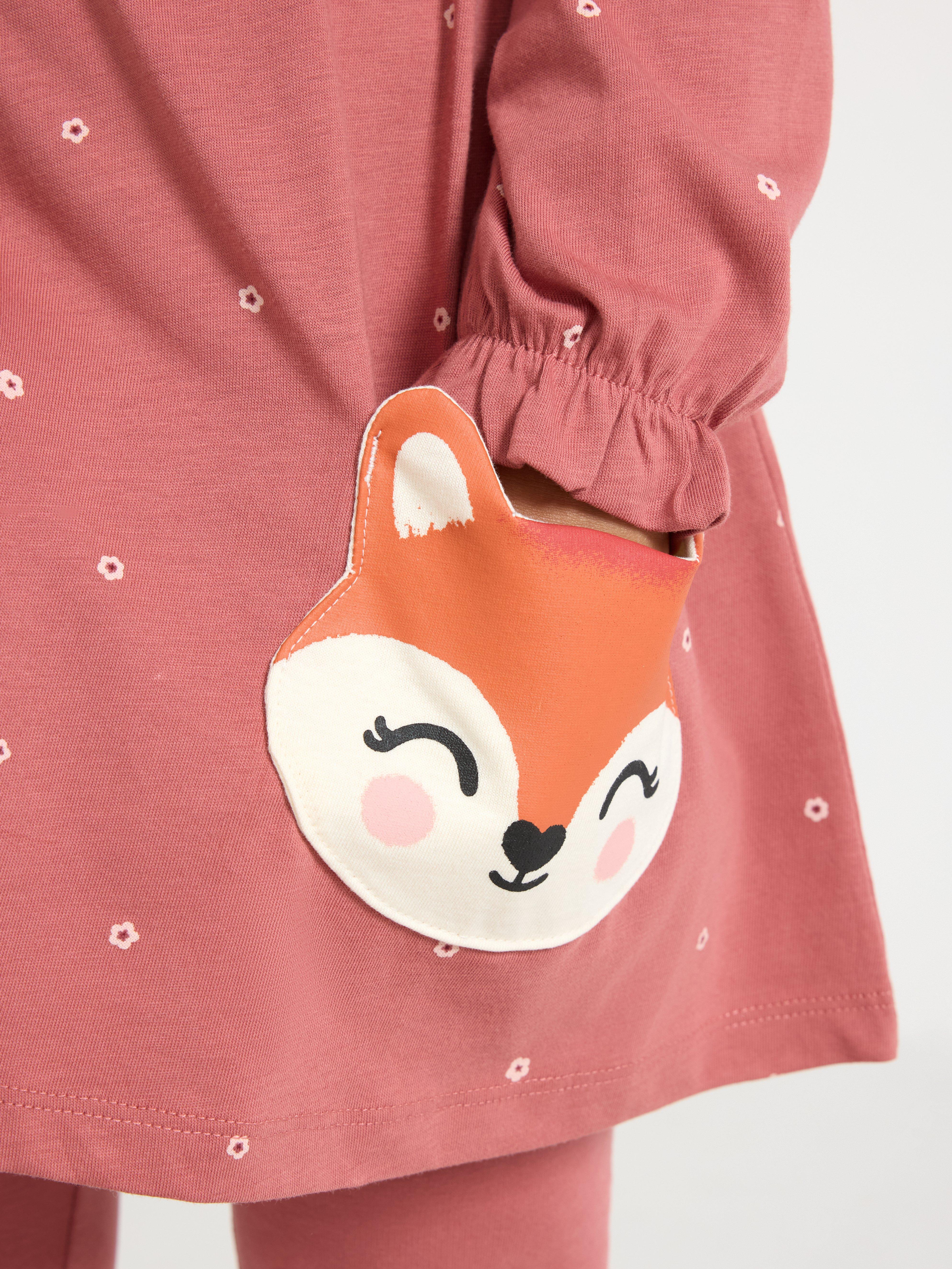 Túnica de manga comprida com bolsos divertidos. Rosa escuro acinzentado.