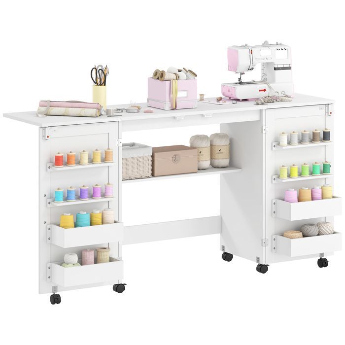 Table de couture - HOMCOM - pliante - roulettes, 2 portes, 4 bacs, 20 crochets - panneau de particules - 160x40x81,5cm - blanc