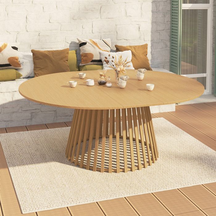 De ronde tuintafel SOLAL, uitschuifbaar van 160 tot 200 cm, biedt plaats aan 6 tot 10 personen en heeft metalen lattenpoten met een houtnerfstructuur.