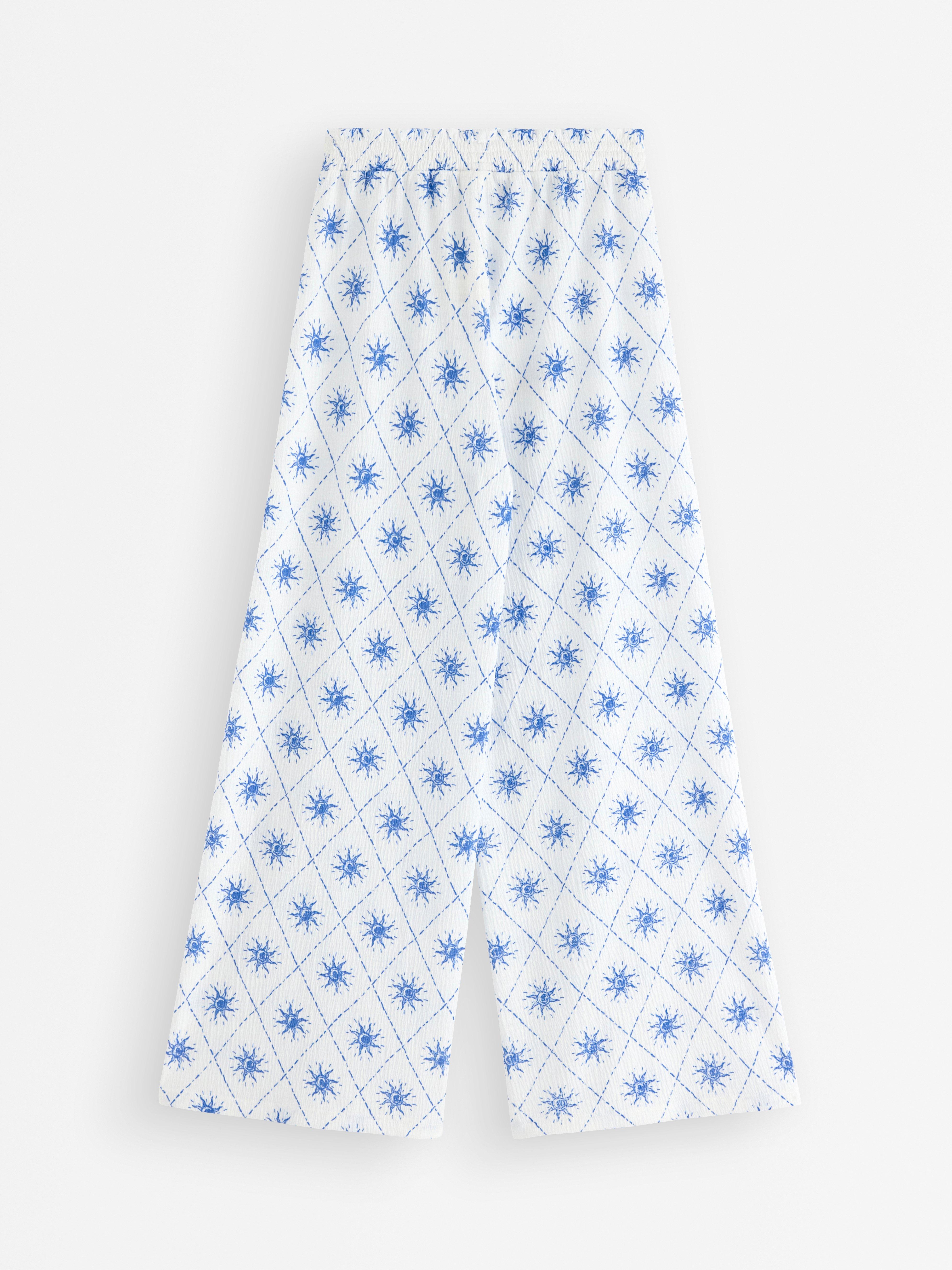 Pantalones de pierna ancha en punto color blanco roto