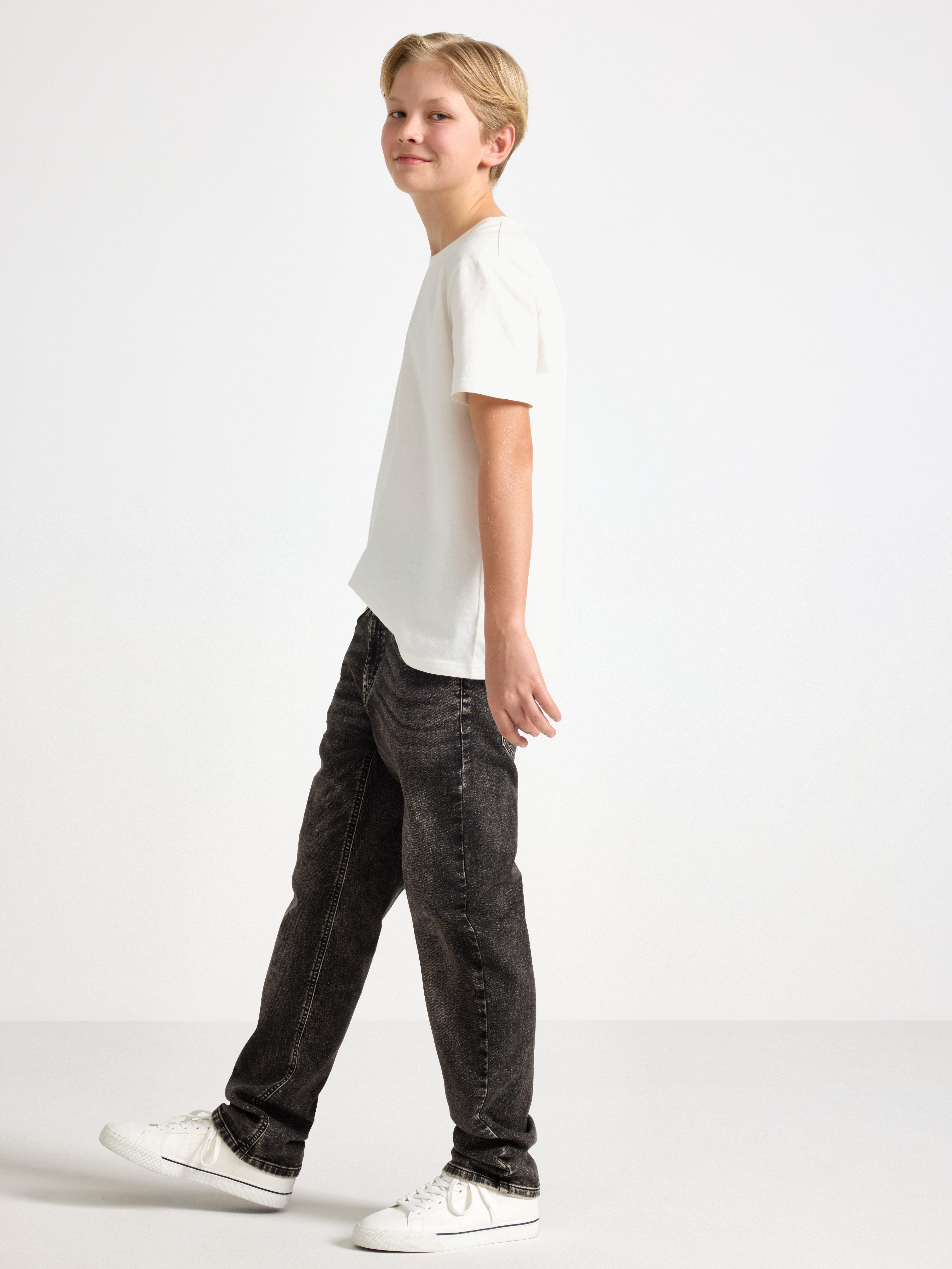 Pantalones vaqueros STAFFAN de punto súper elástico con pierna recta y cintura normal, color negro.