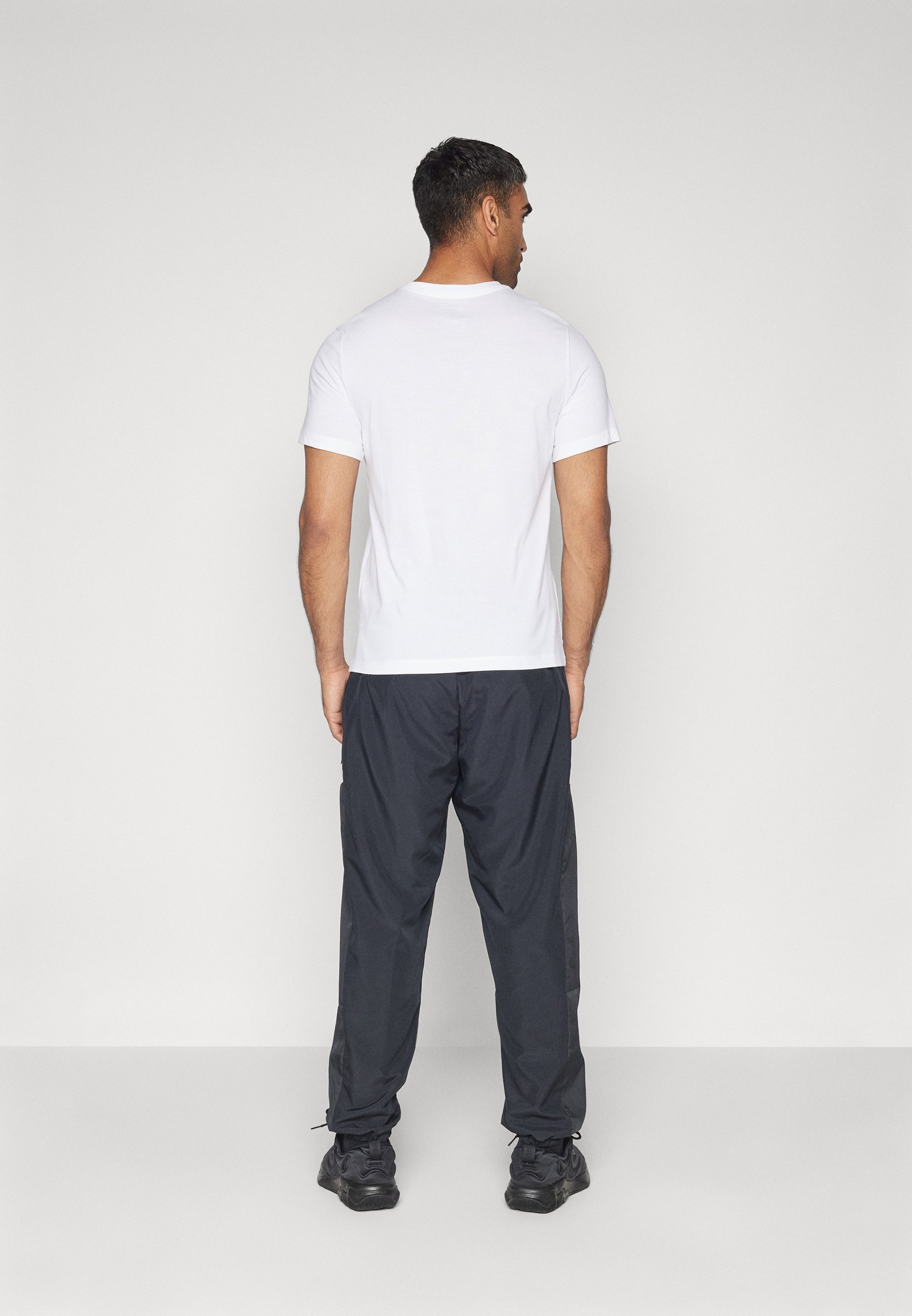 Nike Performance ICON PANT - Teplákové kalhoty - black/white