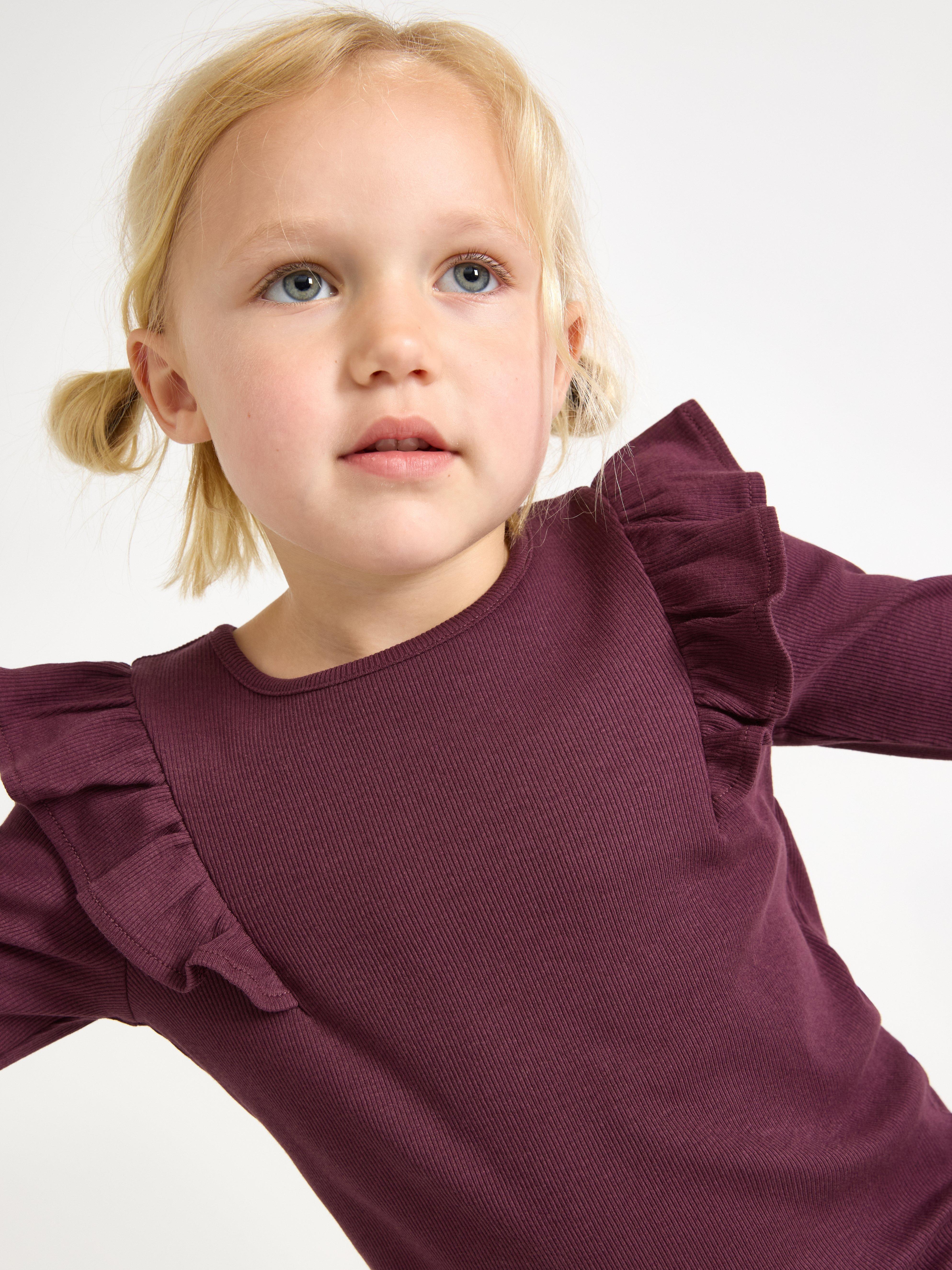 Top de manga larga color lila oscuro empolvado