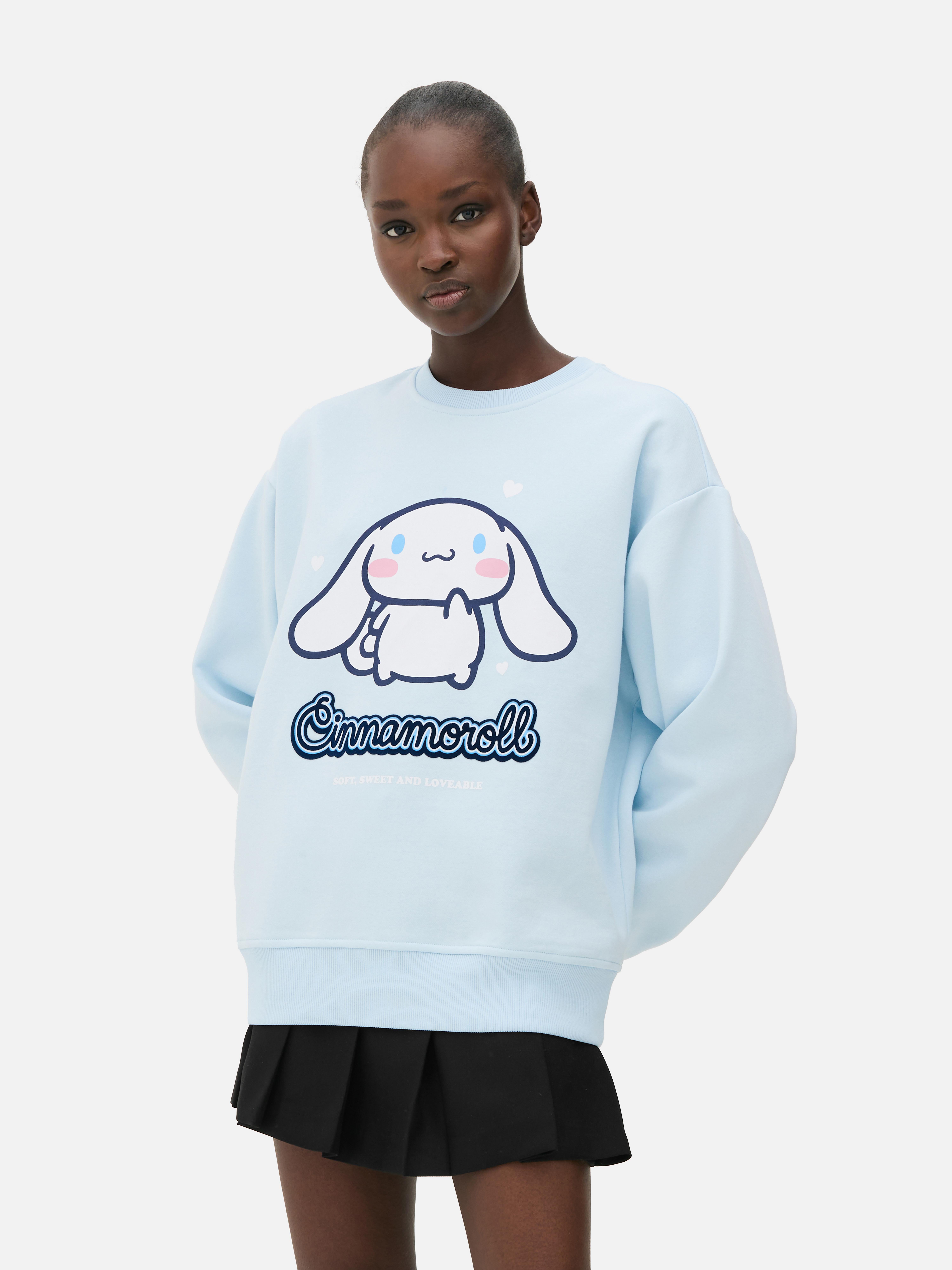 Дуксерица са принтом Hello Kitty и циметом. Санрио дуксерица са округлим изрезом, дугим манжетнама и ребрастим рубом.