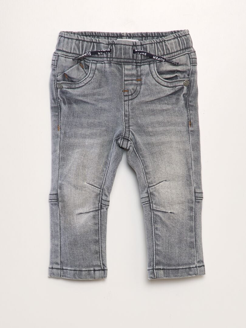 Jeans met uitsnijdingen - GRIJS