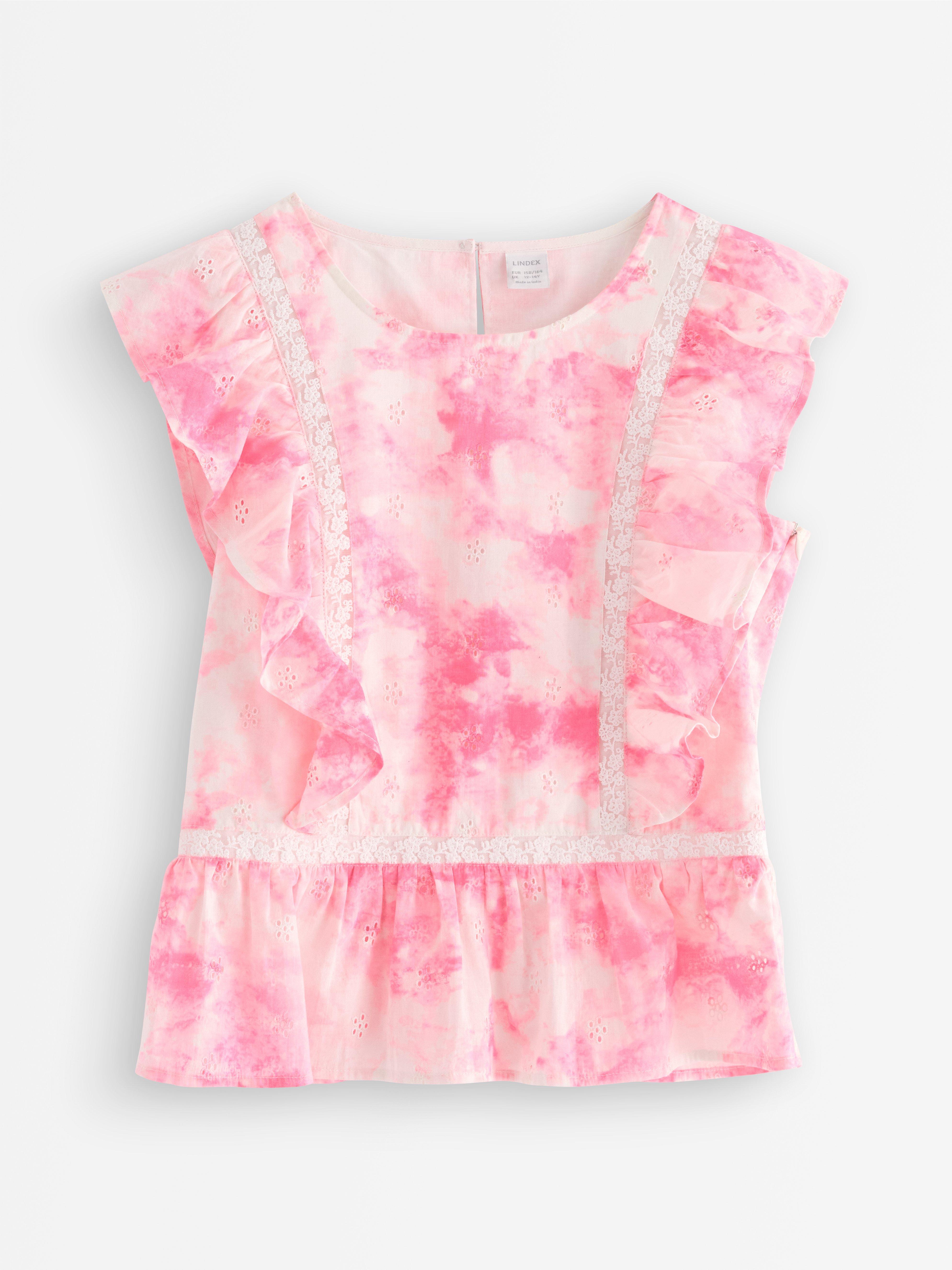 Blusa con volantes rosa claro