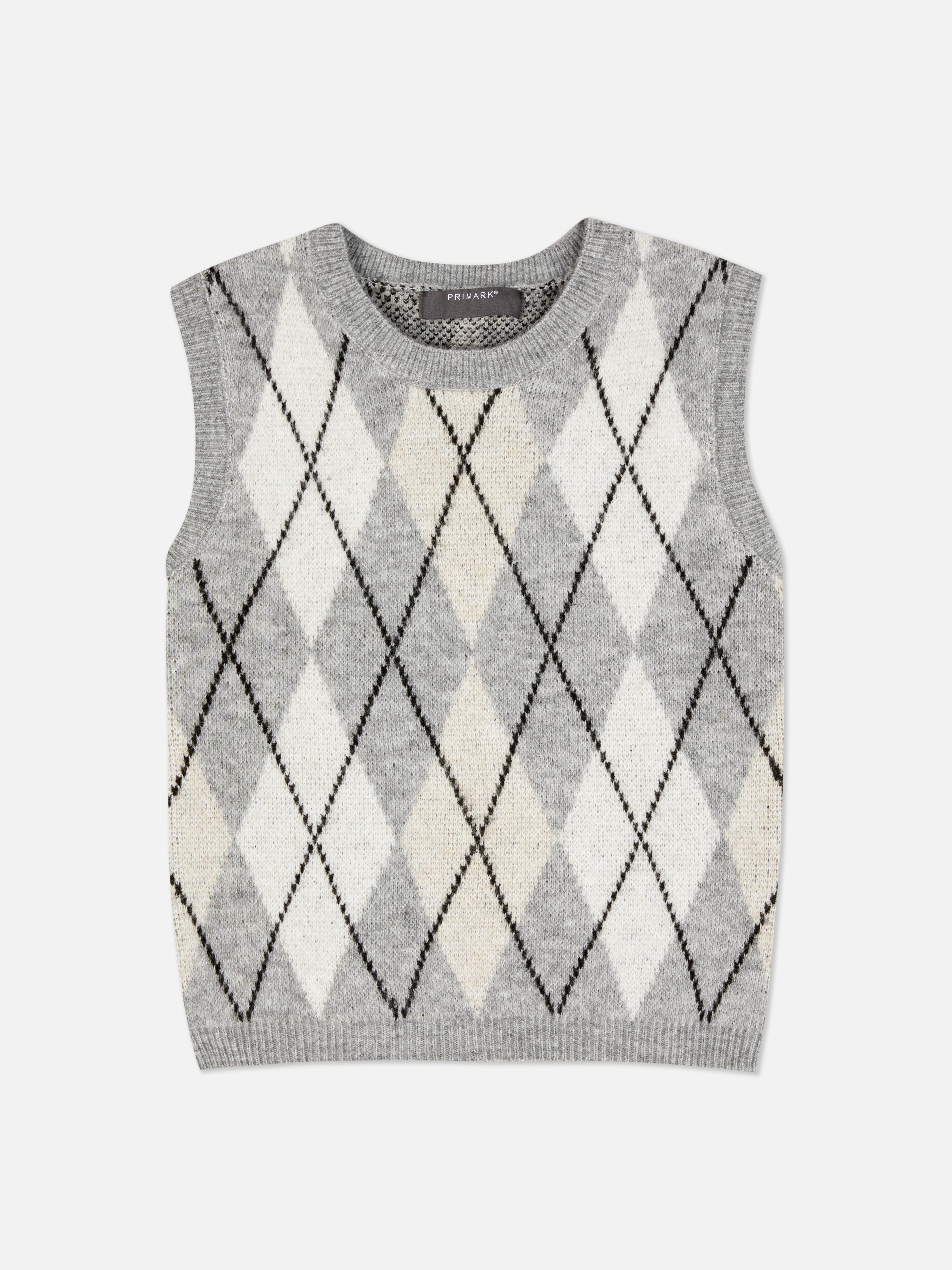 Dzianinowy sweter bez rękawów ze wzorem w romby. Sweter bez rękawów ze ściągaczami przy mankietach i klasycznym wzorem w romby.