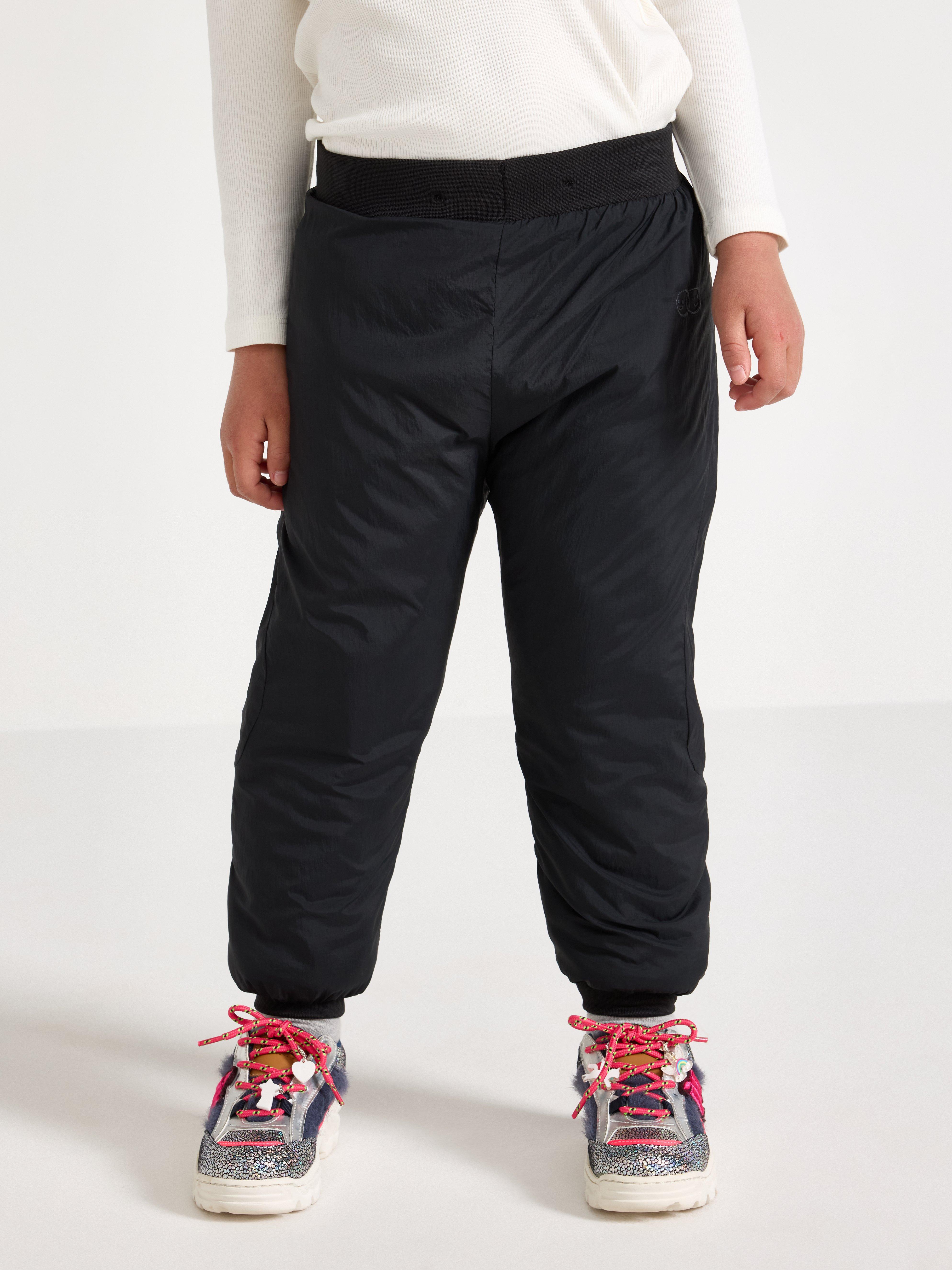 Pantalones ligeros, acolchados e impermeables – Ropa deportiva infantil negra