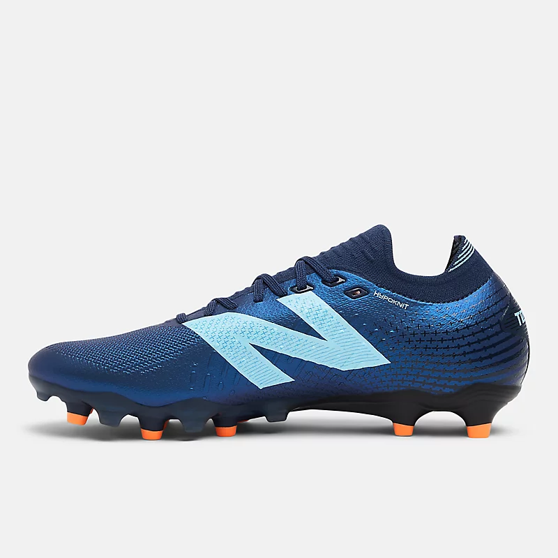 Zapatillas unisex TEKELA PRO LOW FG V4+ - NB Navy z Team Sky Blue i Hot Mango